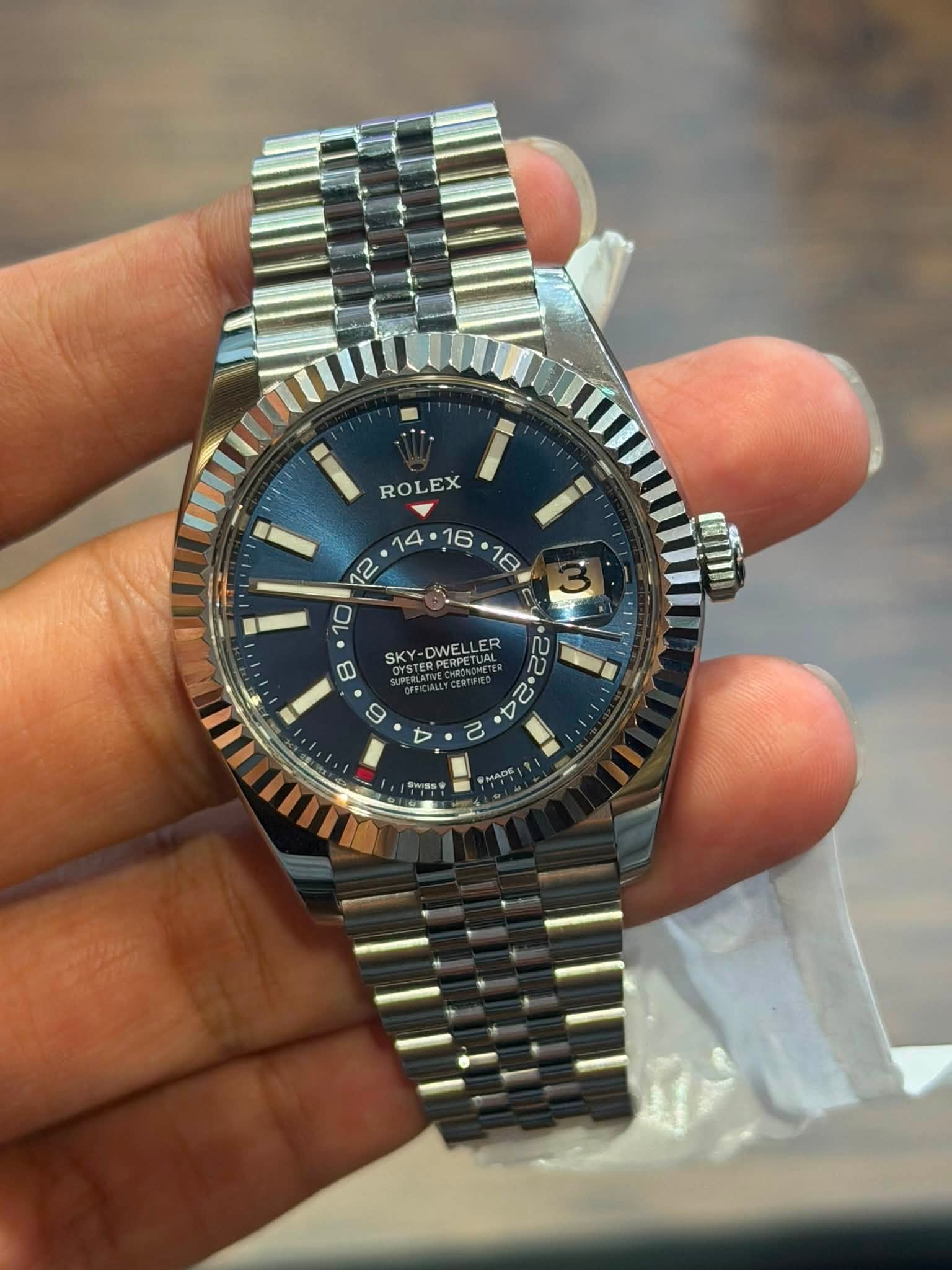 May be an image of wrist watch and text that says 'ROLEX S ۲ 10 ወ SKY-DWELLER SK SKYOCESPETUAL CXY-DWELLER -DWEL KY-DWEL 2 い 9 A く E Π'