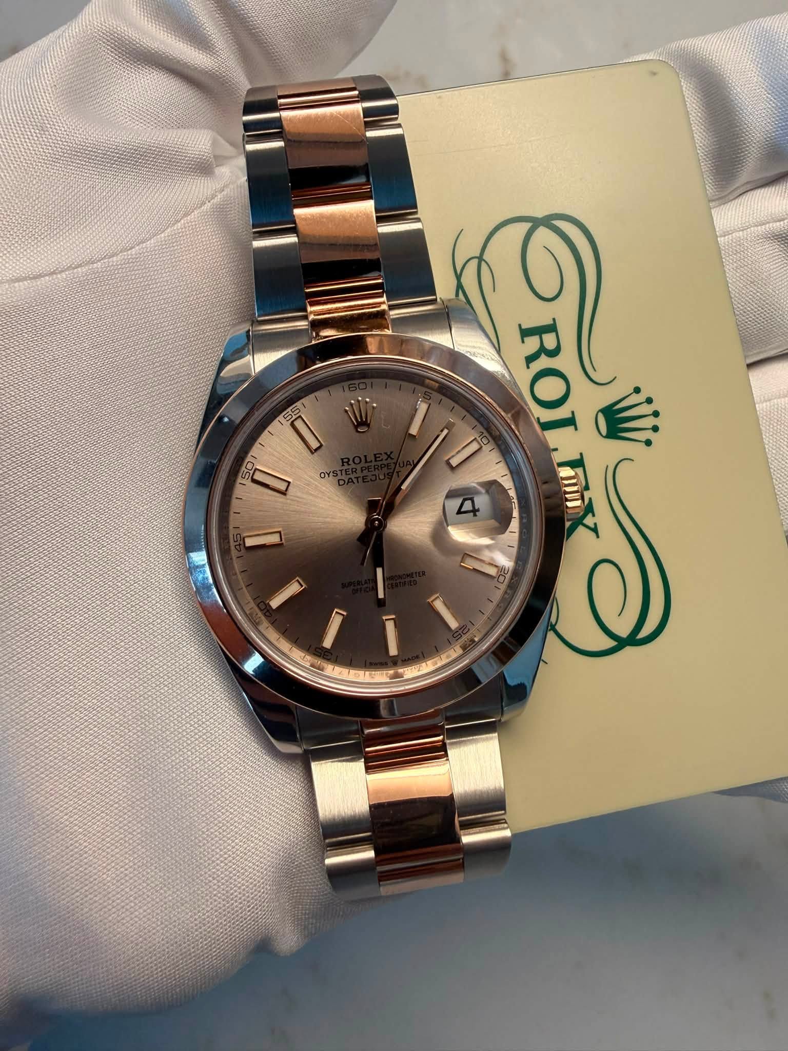 May be an image of wrist watch and text that says '55 D or ا ROLNX Tmin ROI W E Y'