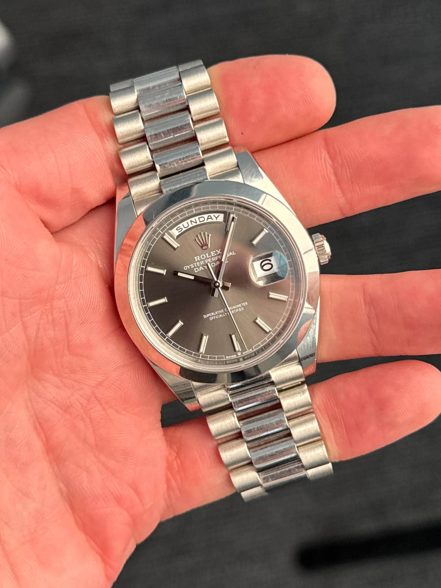 May be an image of wrist watch and text