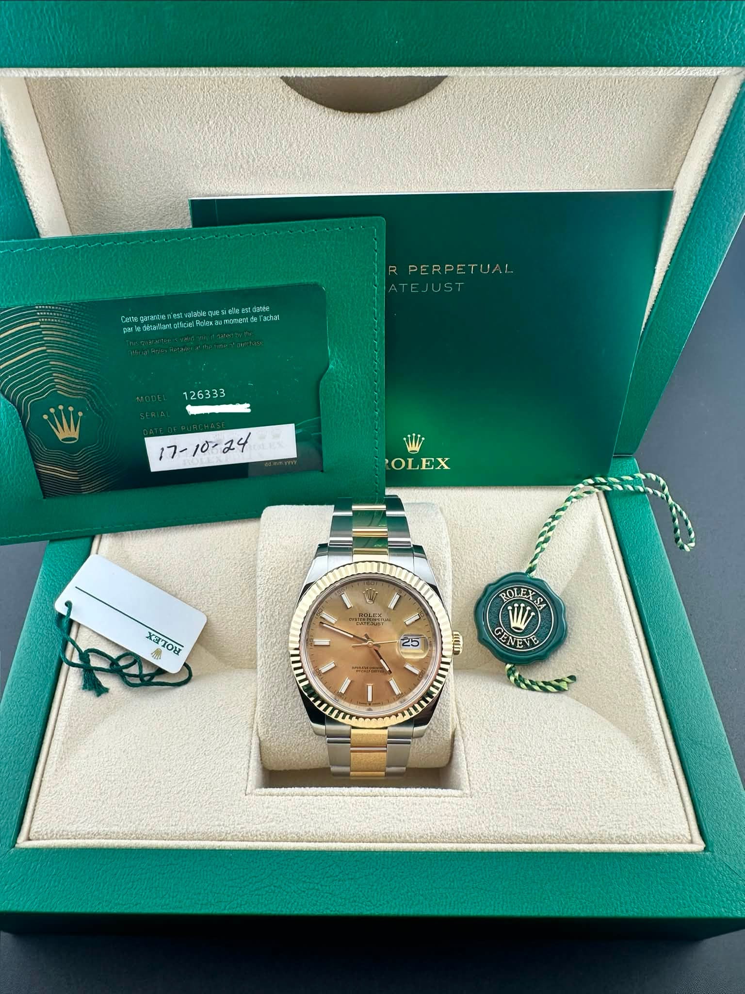 May be an image of wrist watch and text