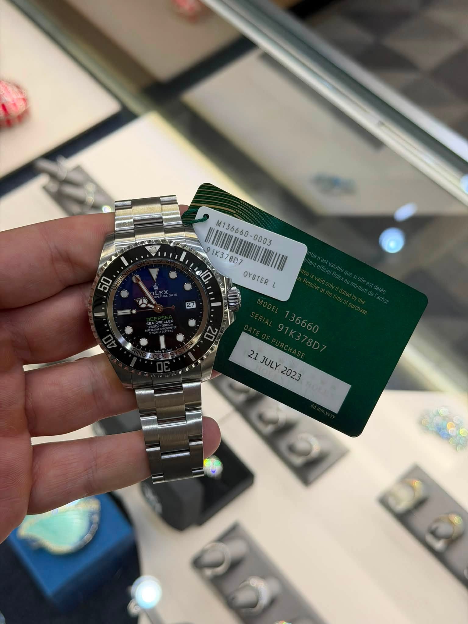 May be an image of wrist watch and text that says '50 M136660- M136660- 1K3 1K378D7 即 8D7 37 dl0, OYSTER L 21 社 21 এলতা 21JULY JULY 2023 2G'