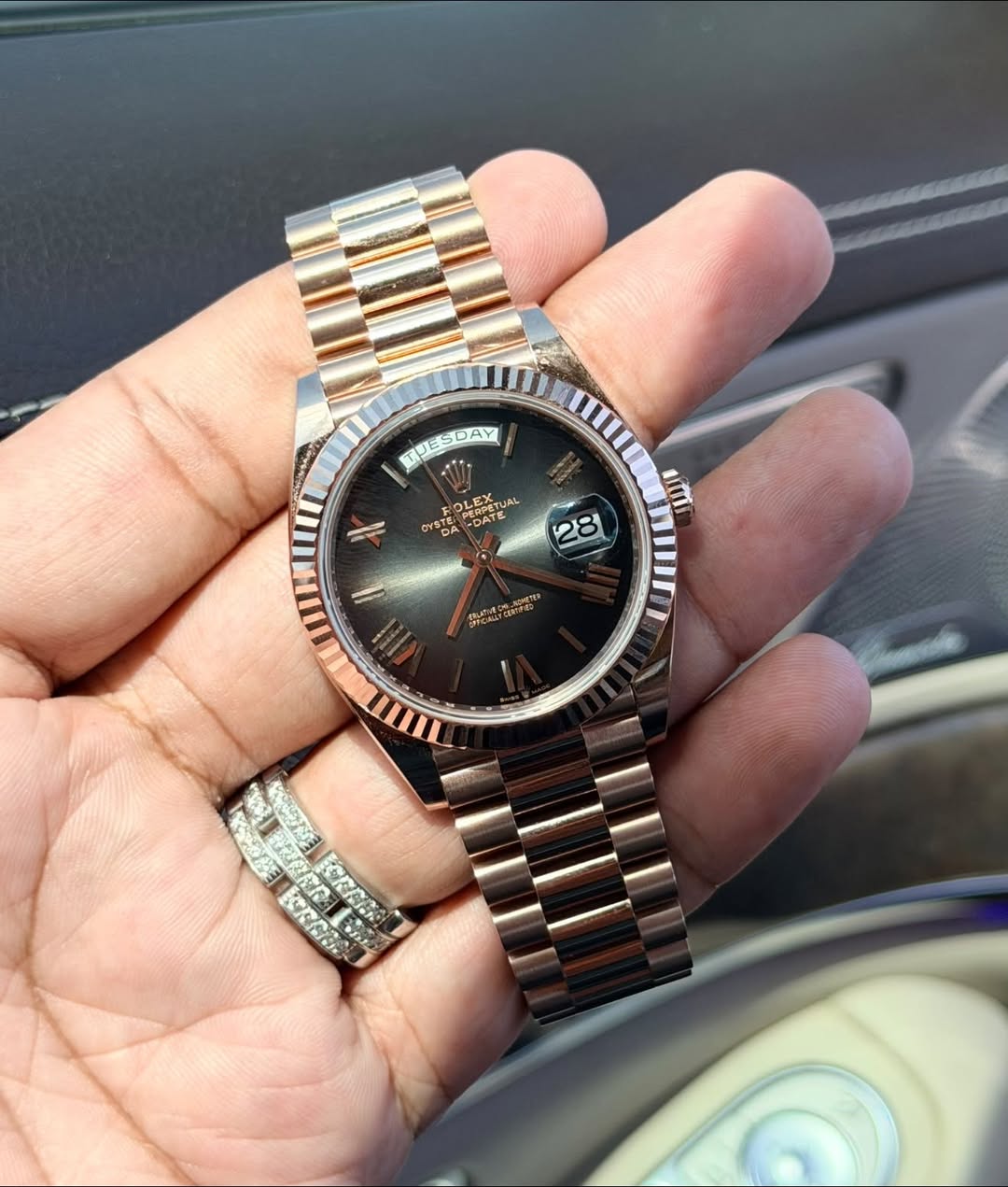May be an image of wrist watch and text