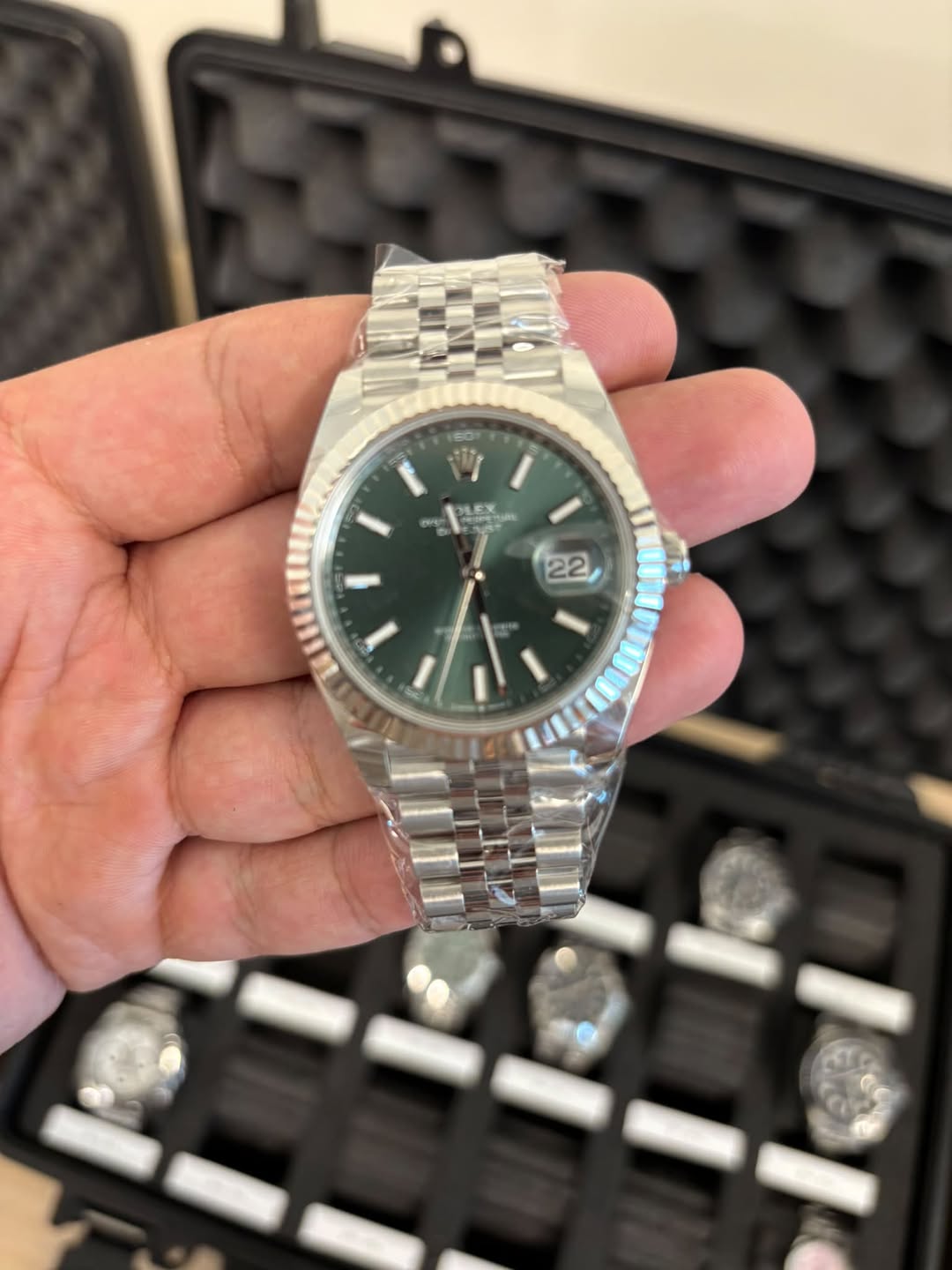 May be an image of wrist watch and text