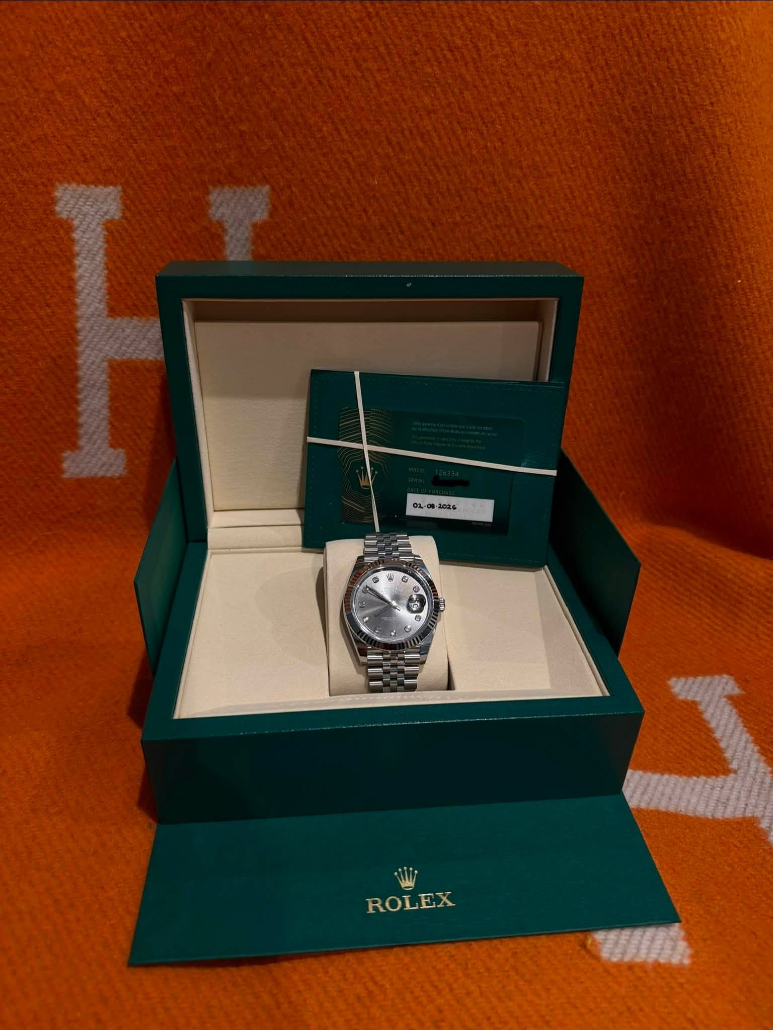 May be an image of wrist watch and text that says ' ROLEX'