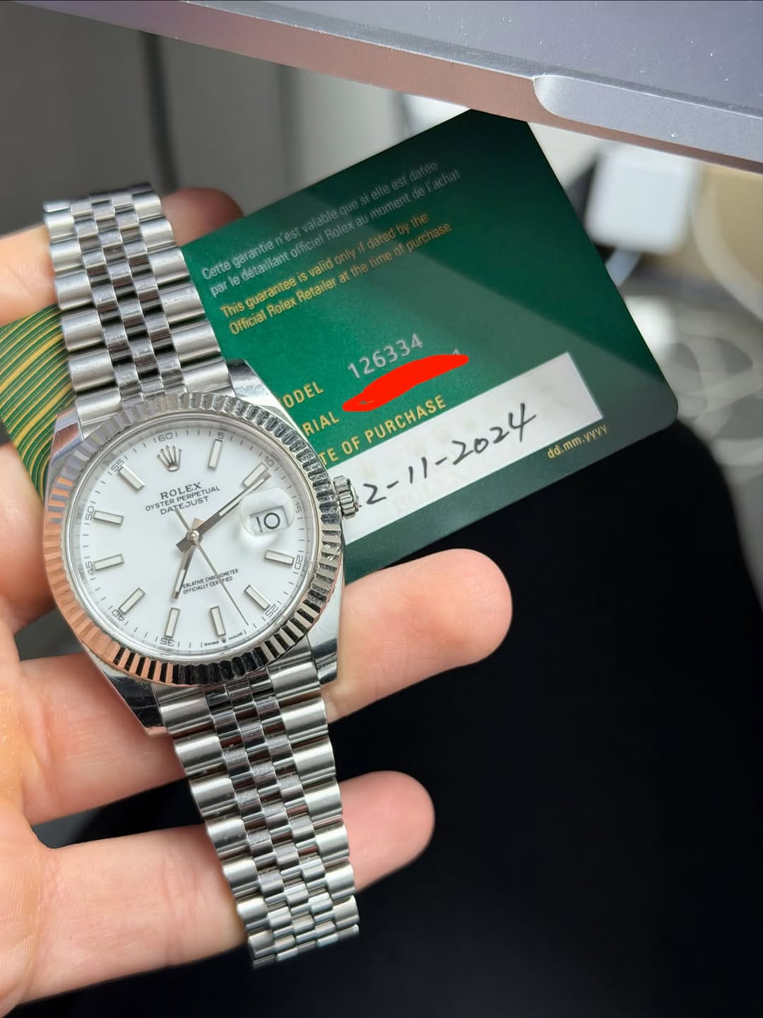 May be an image of wrist watch and text that says 'garantie offic Cette detaillant Getana cuaranter valid par This Rolex juarantee Retailer at Official 80 S5 ODEL RIAL PURCHASE OF…