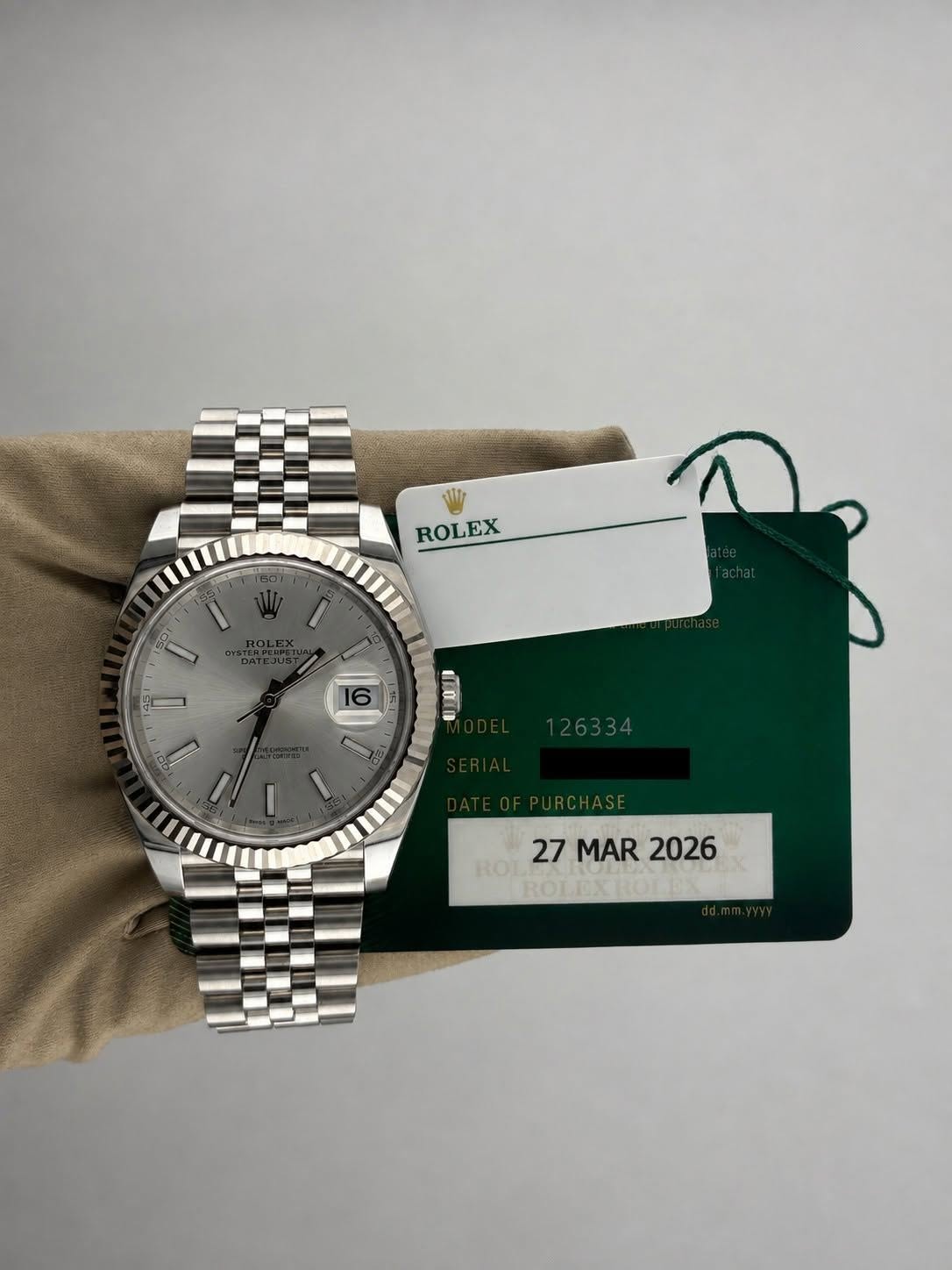 May be an image of wrist watch and text that says 'ROLEX 16 LOTn 27MAR2026 ROT 27 MAR 27MAR2026 2026 ROLEX'