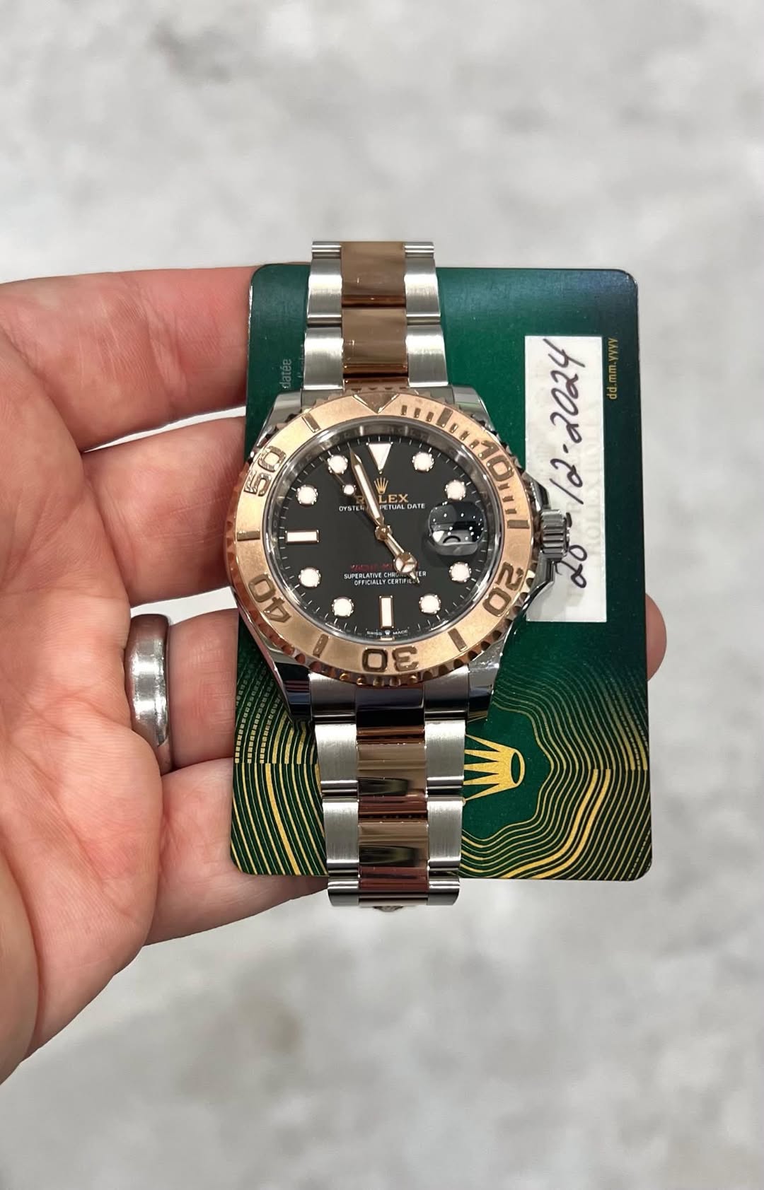 May be an image of wrist watch and text