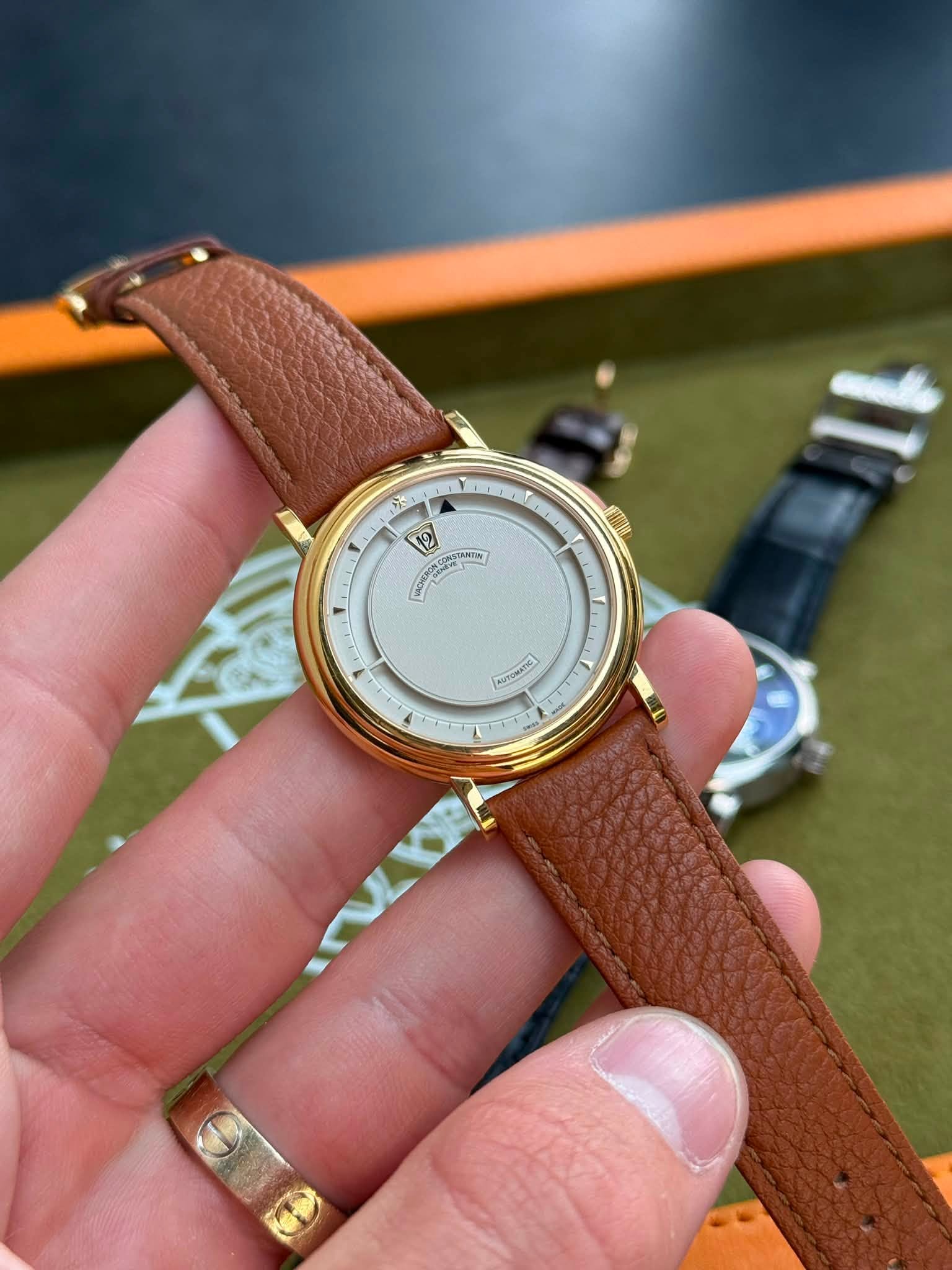 May be an image of wrist watch and text