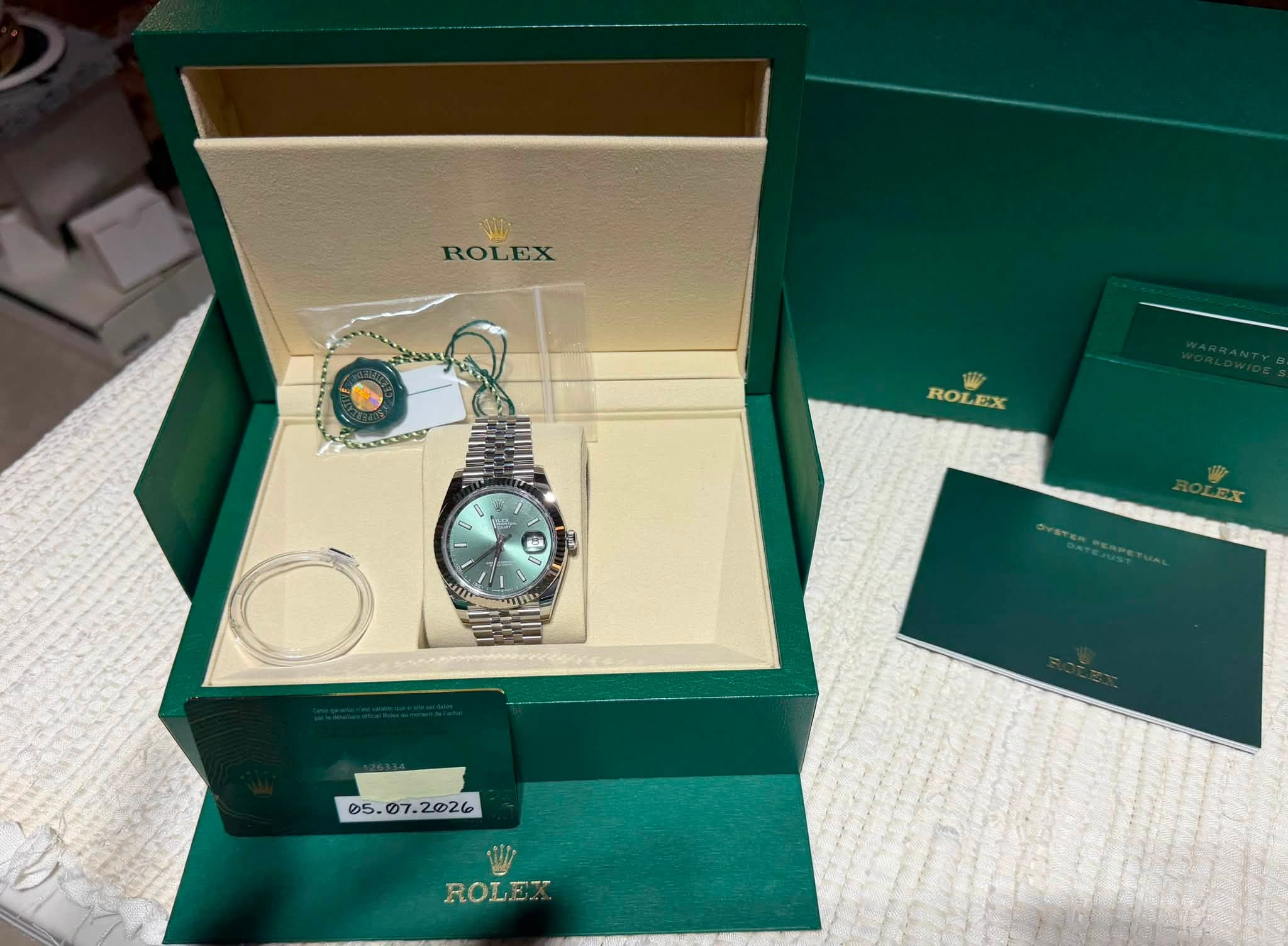 May be an image of wrist watch and text that says 'ROLEX ROLEX ROLEX ROL pp D מצווי ROLEX'