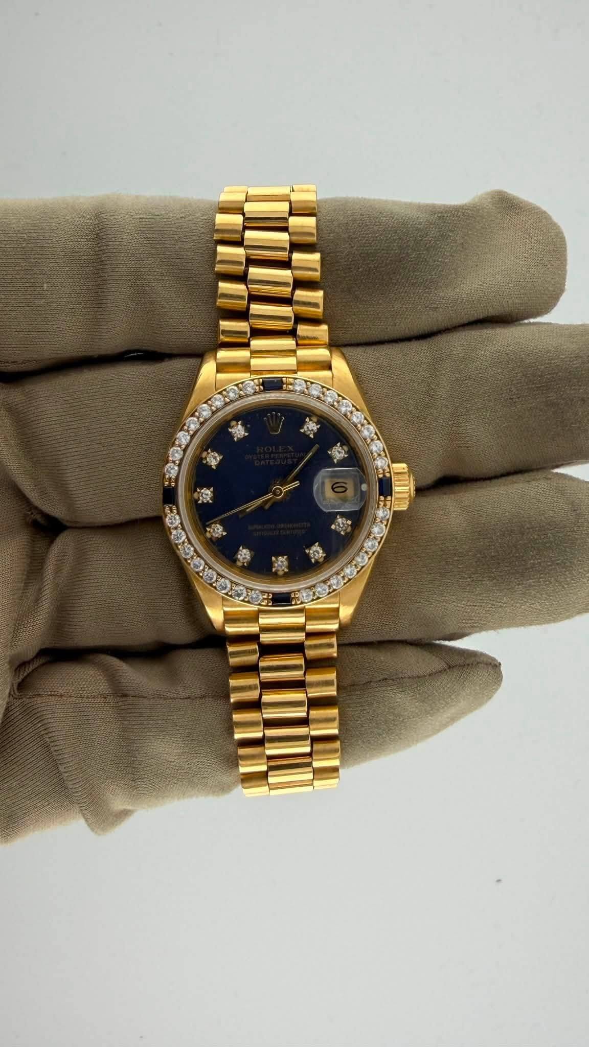 May be an image of wrist watch and text