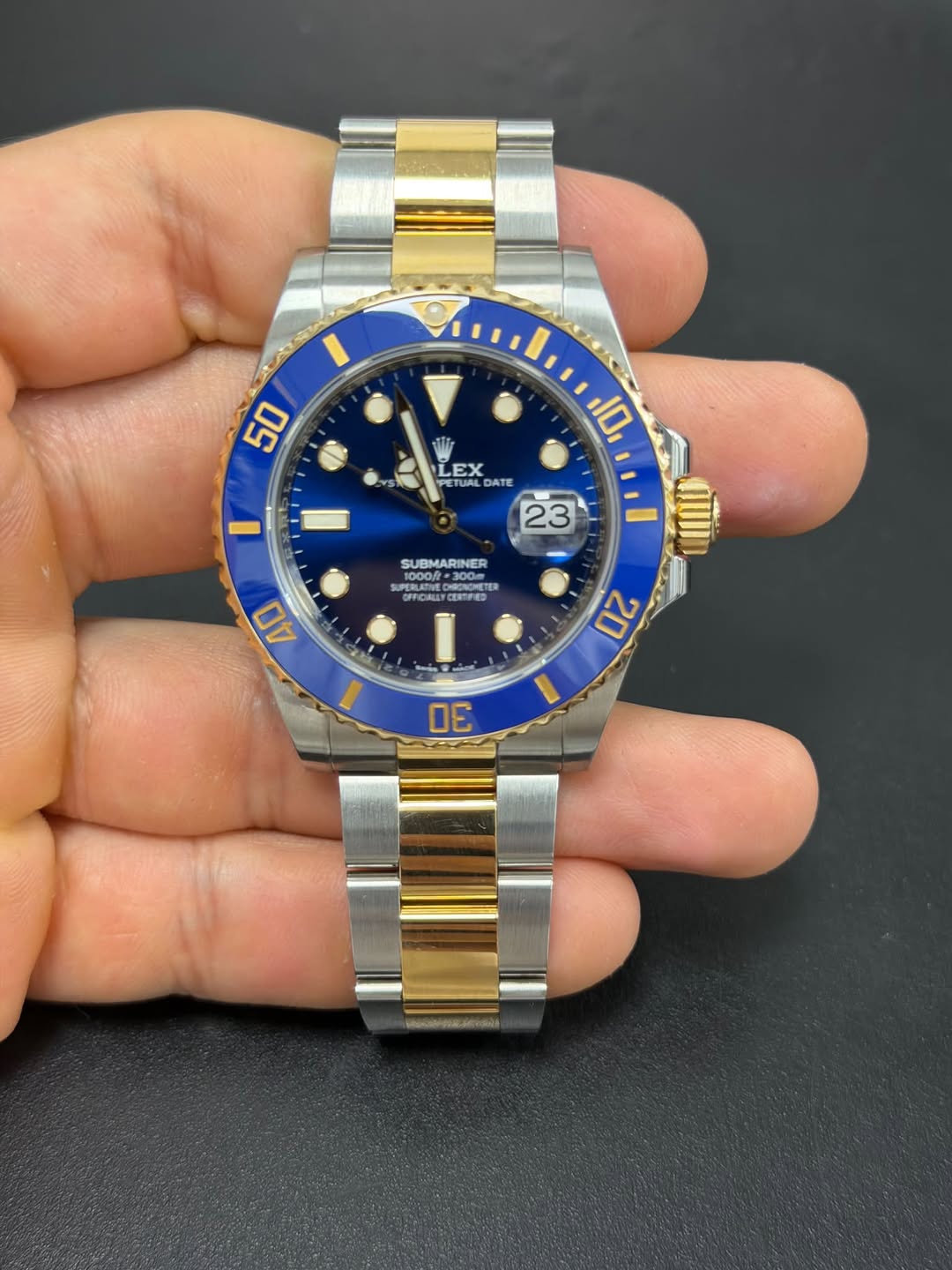 May be an image of wrist watch and text