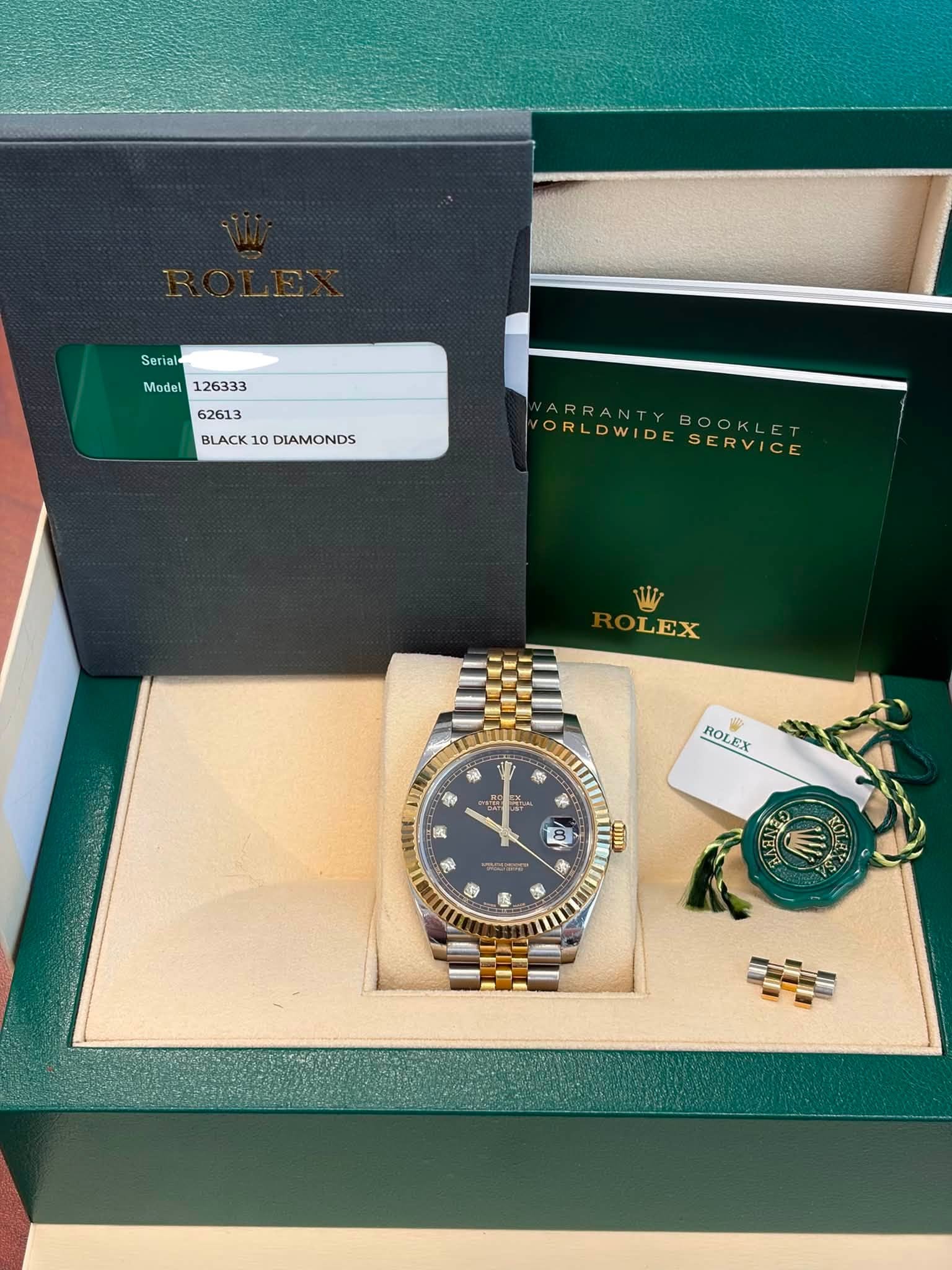 May be an image of wrist watch and text that says 'Serial Model BLACK10DIAMONDS BLACK1 DIAMONDS VARRANTYBOOKLET ARRANTY VORLDWID ORLDWIDESERVICE WIDE SERVICE OLEX 希 紙 ROLEX 3 d 黑 豊…