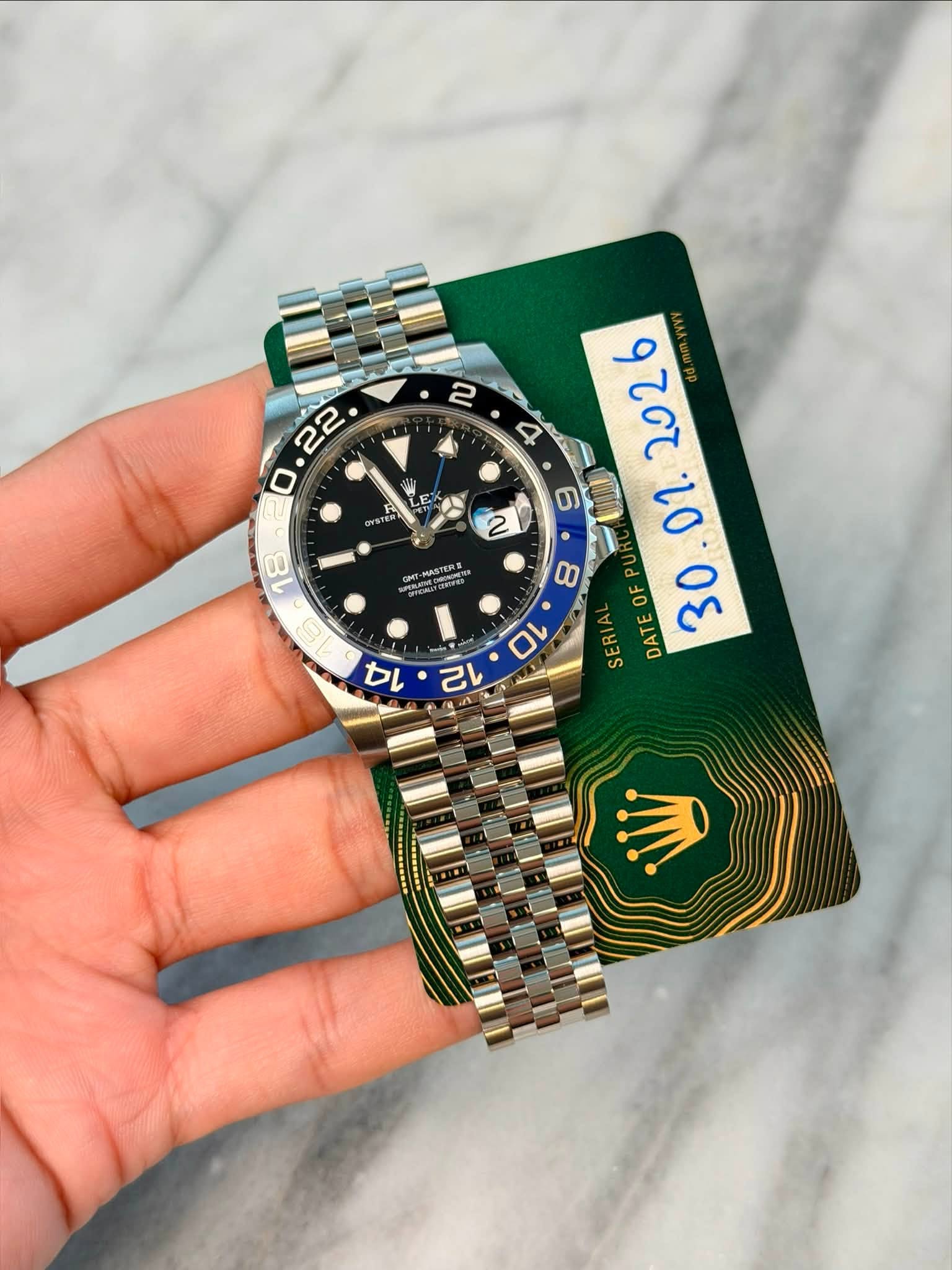 May be an image of wrist watch and text
