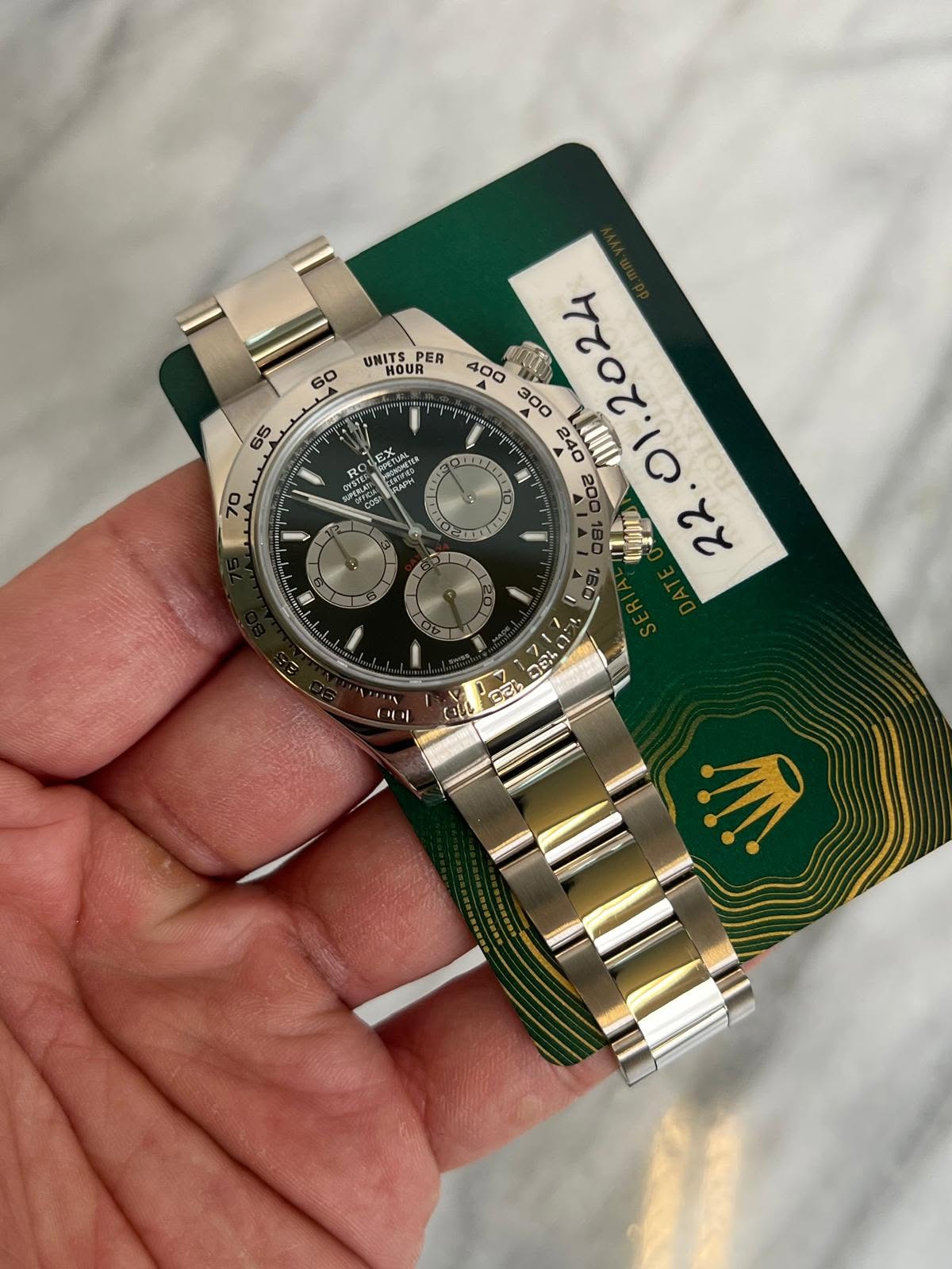 May be an image of wrist watch and text