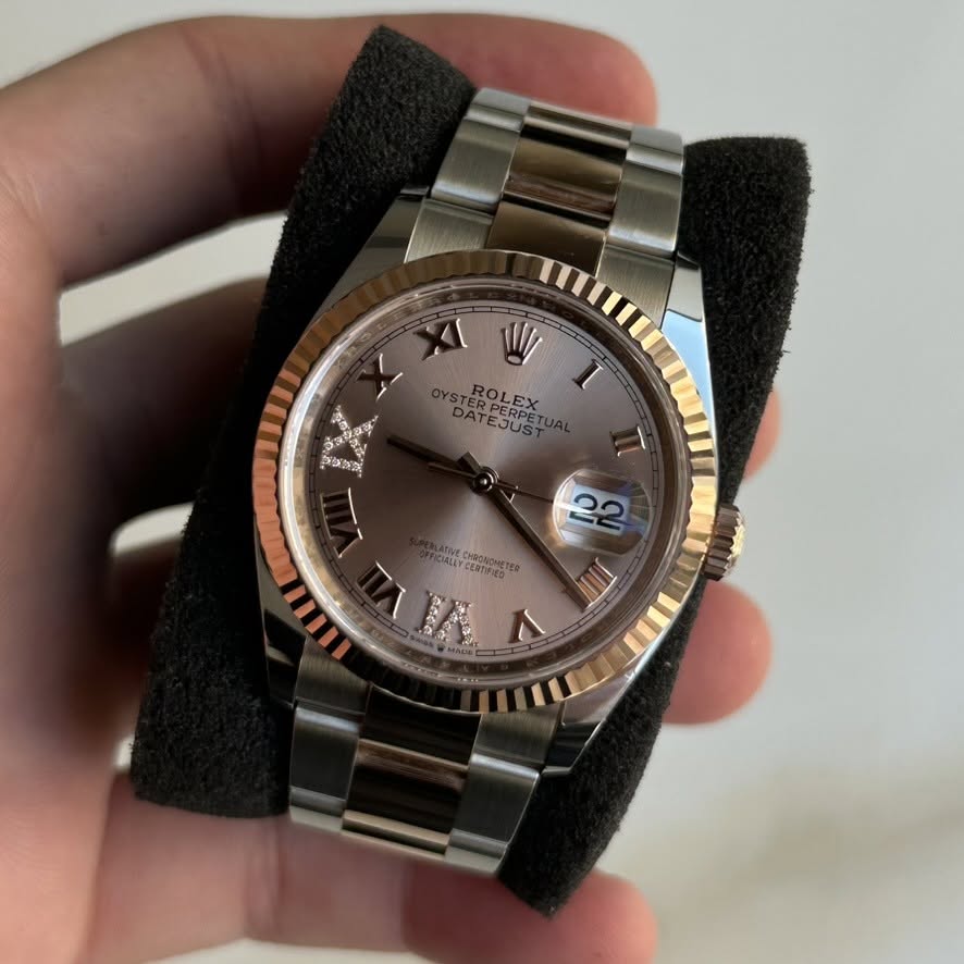 May be an image of wrist watch and text