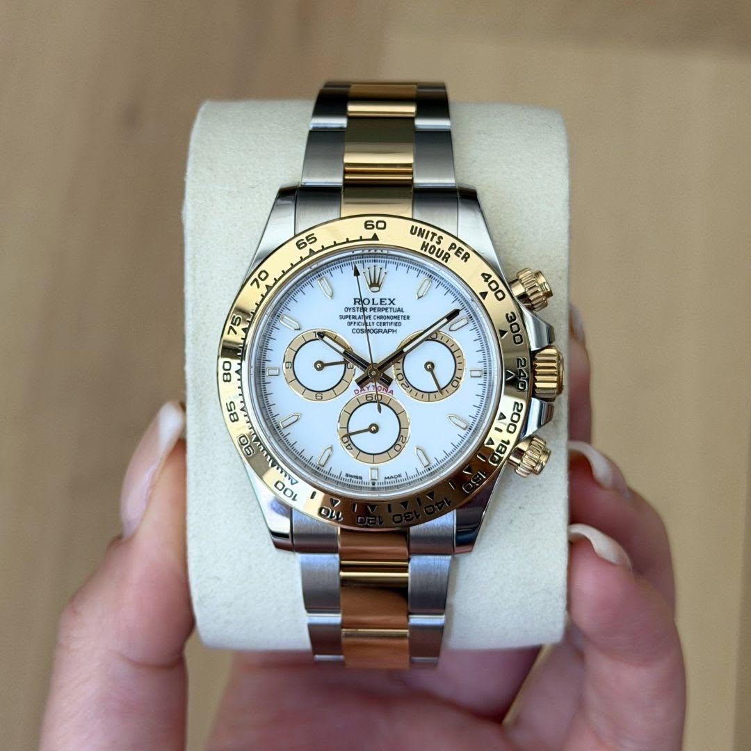 May be an image of wrist watch and text
