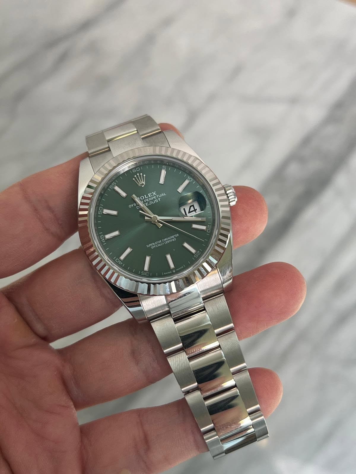 May be an image of wrist watch and text