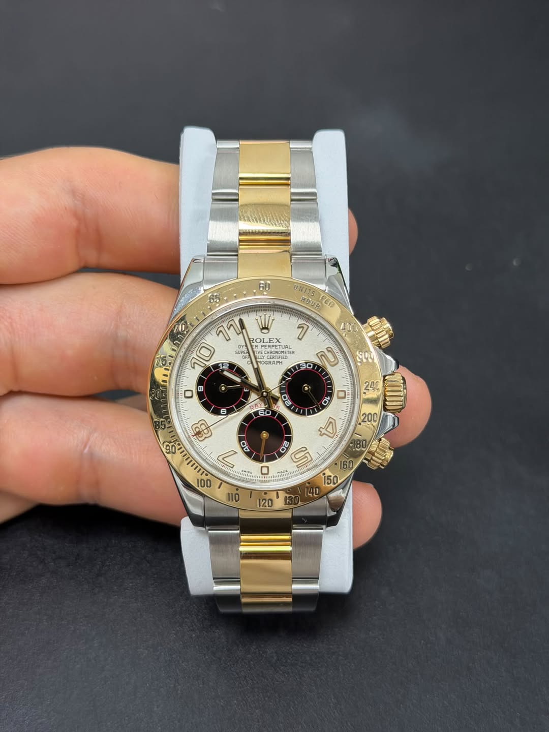 May be an image of wrist watch and text