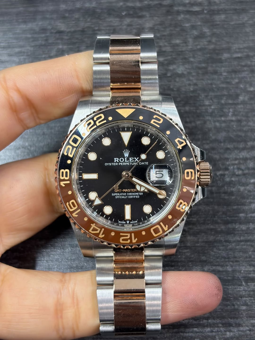 May be an image of wrist watch and text