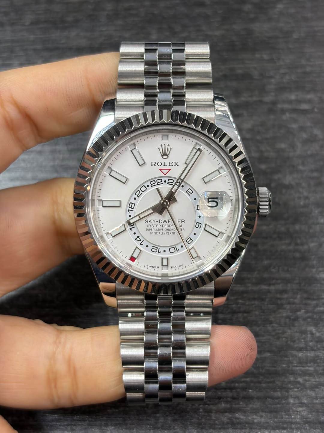 May be an image of wrist watch and text