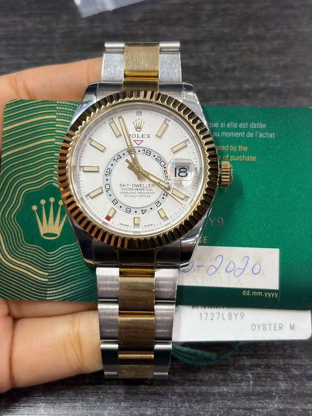May be an image of wrist watch and text