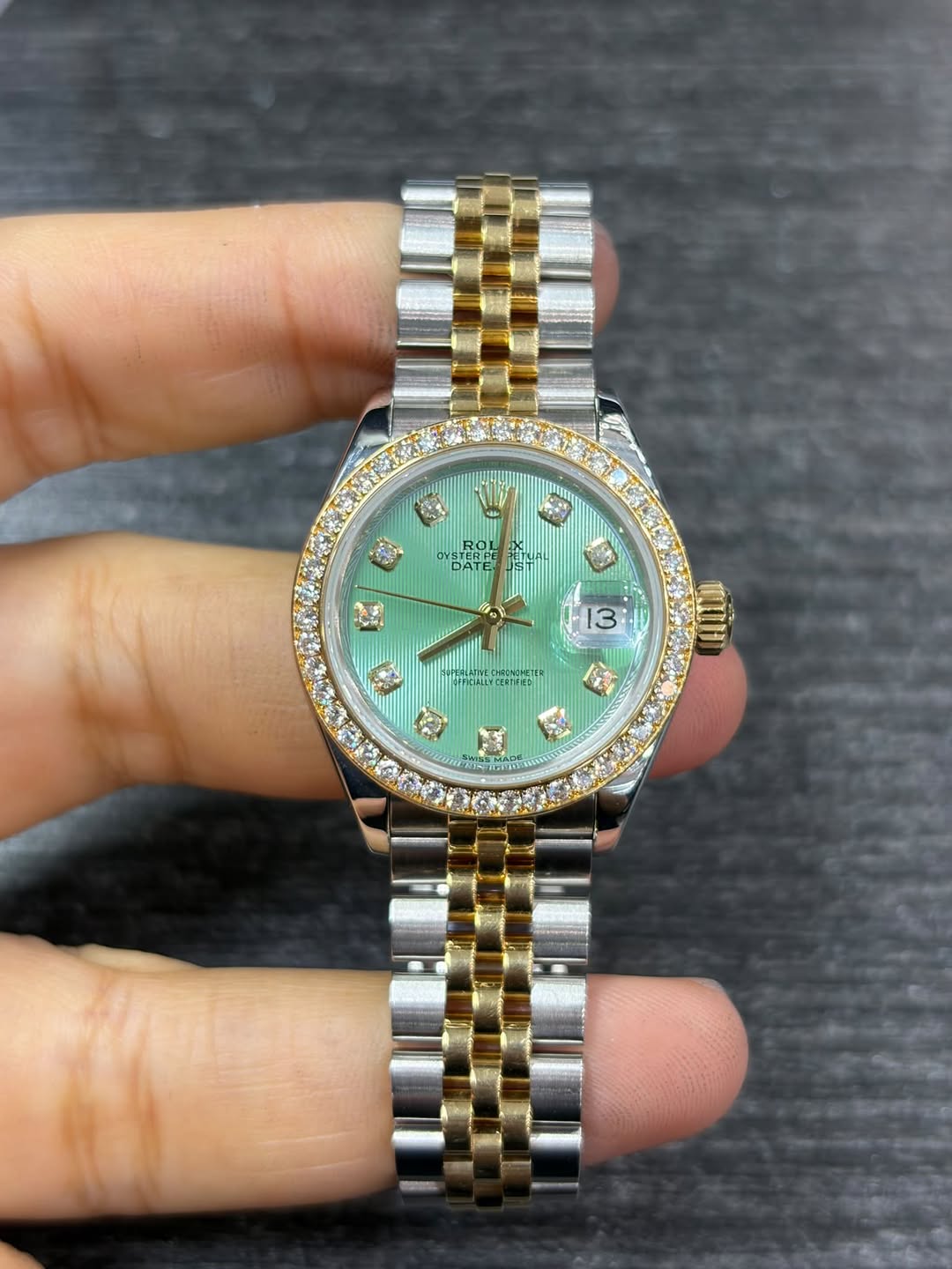 May be an image of wrist watch and text
