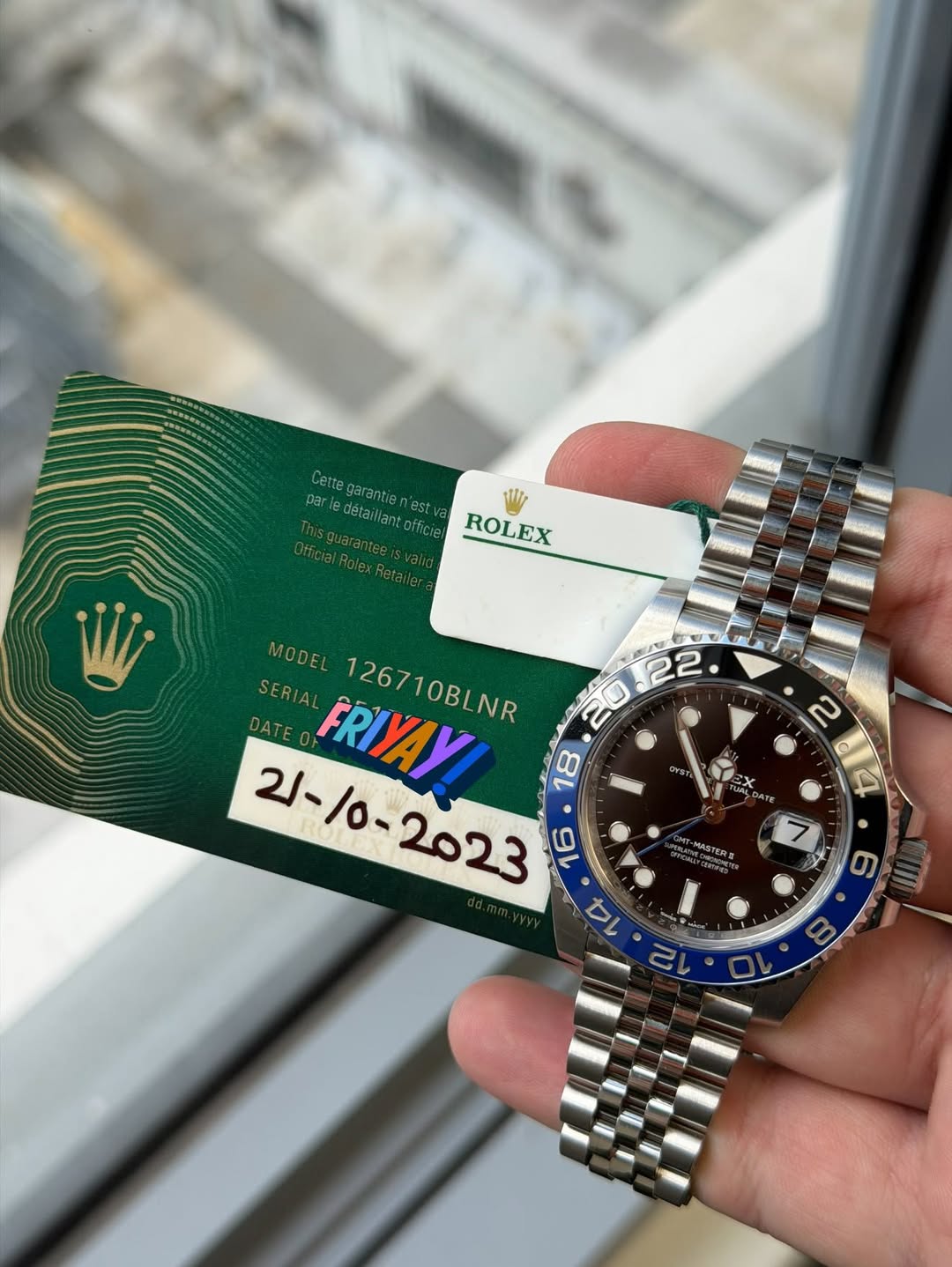 May be an image of wrist watch and text that says 'par Certegarention'es arledétaillantofficie 18 ROLEX cesvana נ MODEL למשם 22 SERIAL FRIYAY! 126710BLNR 20 21-/ -/0- 18 14 อหรา…