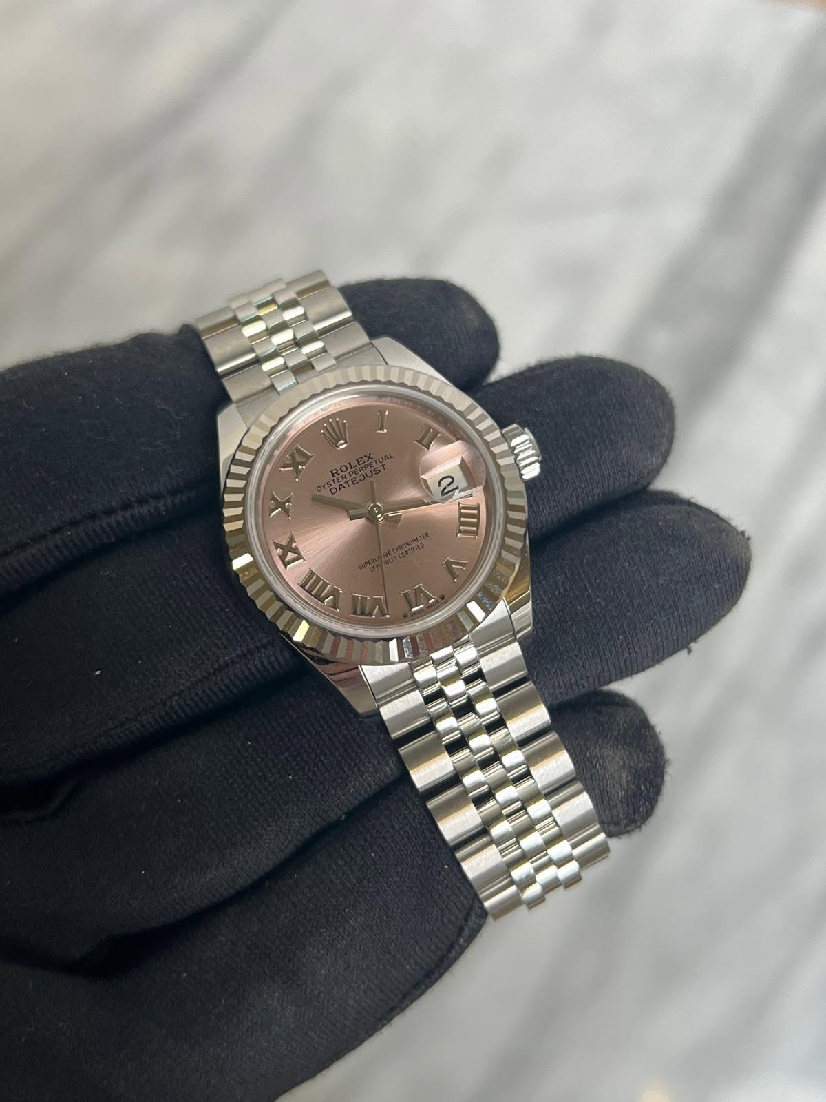May be an image of wrist watch and text that says '2 CH C IIII li AA IX III -مـ'