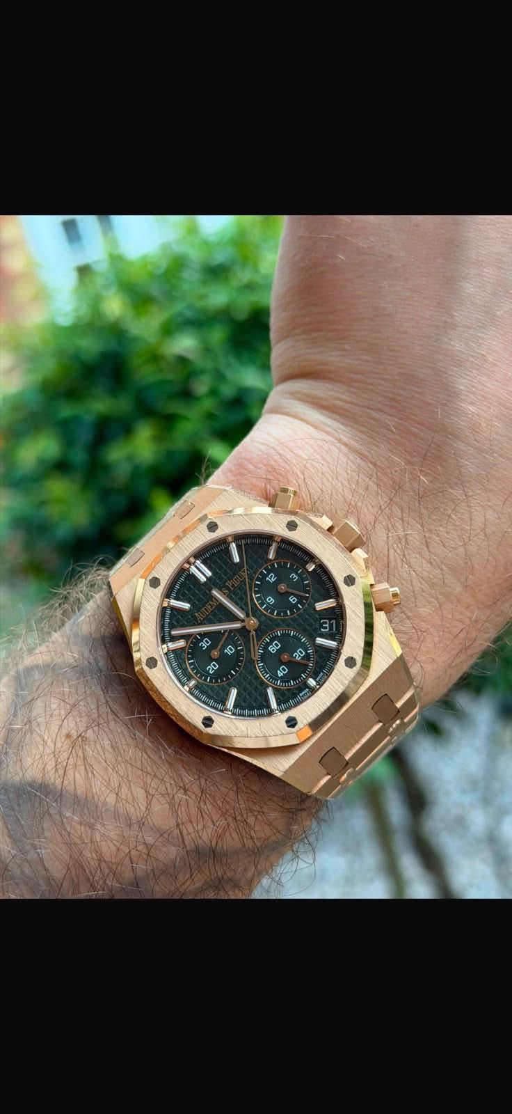 May be an image of wrist watch and text