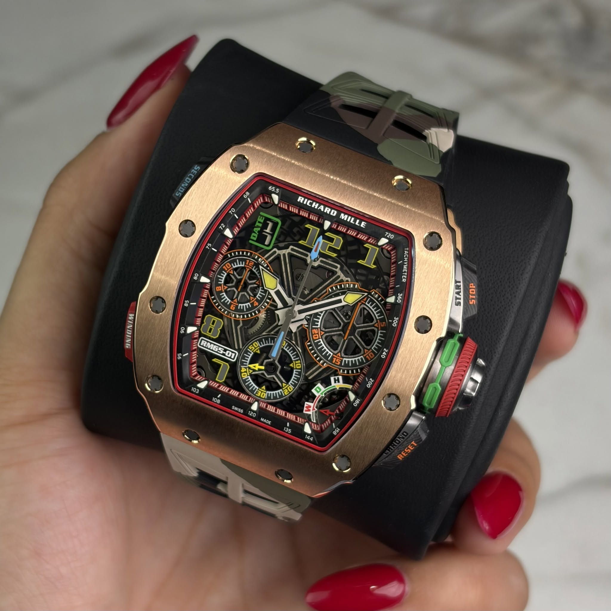 May be an image of wrist watch and text