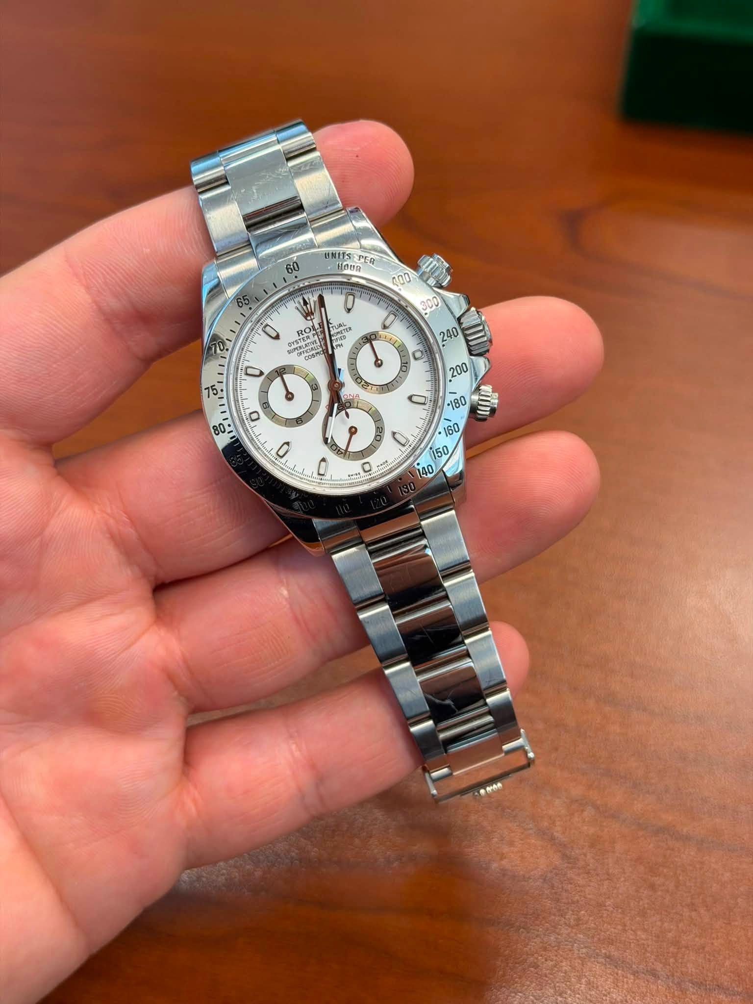 May be an image of wrist watch and text