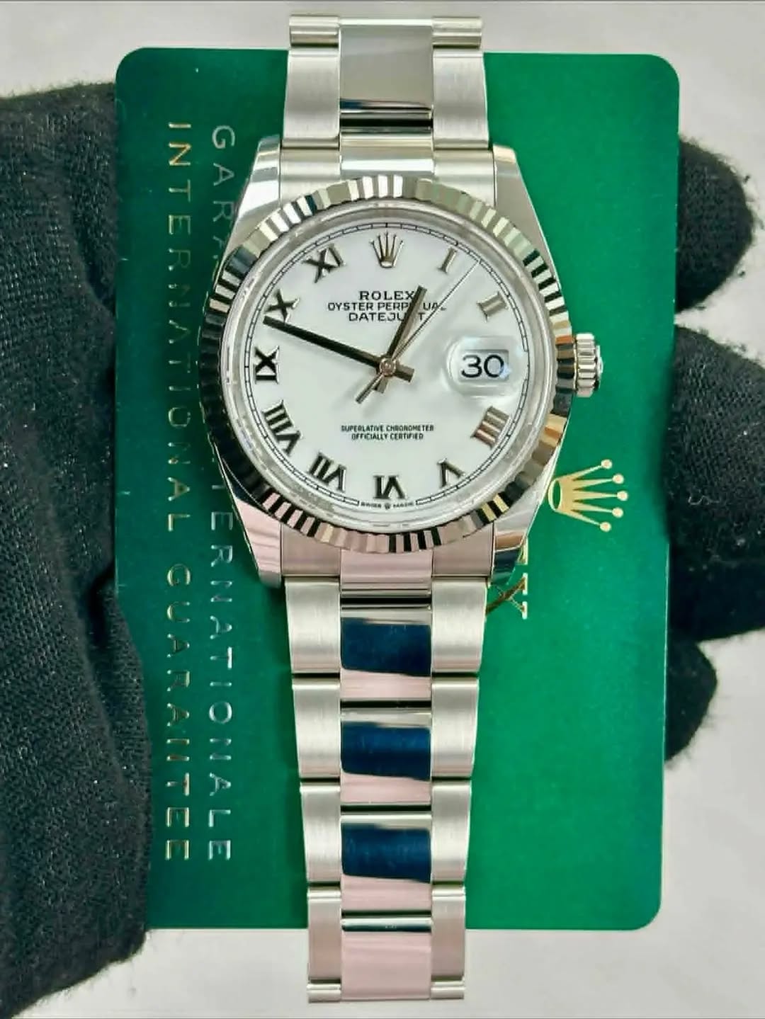 May be an image of wrist watch and text