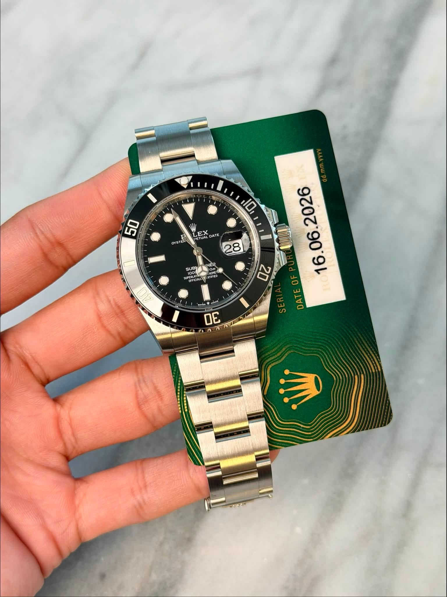 May be an image of wrist watch and text that says '10 50 EX DATE 28 SUCT NER FCA DAT سعن DE'
