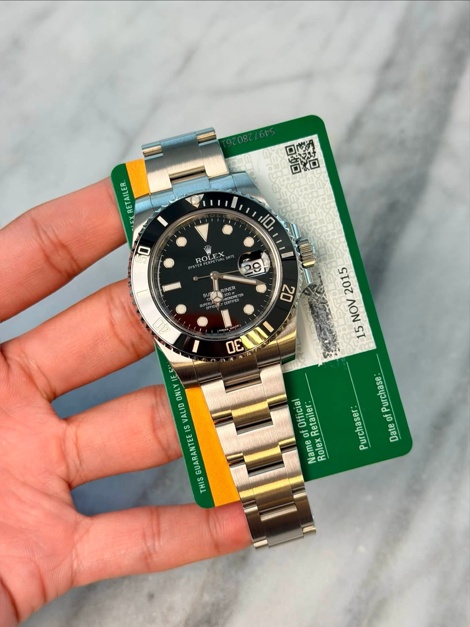 May be an image of wrist watch and text that says 'ロロ ጋኩ モべ 实口 RETAILER. E D 10 ROL I 29 a0 2015 NO 15 20 OE หถา F 2 EE 1 ဟ จร Purchase Purchaser: of Date Official Retailer: Name…