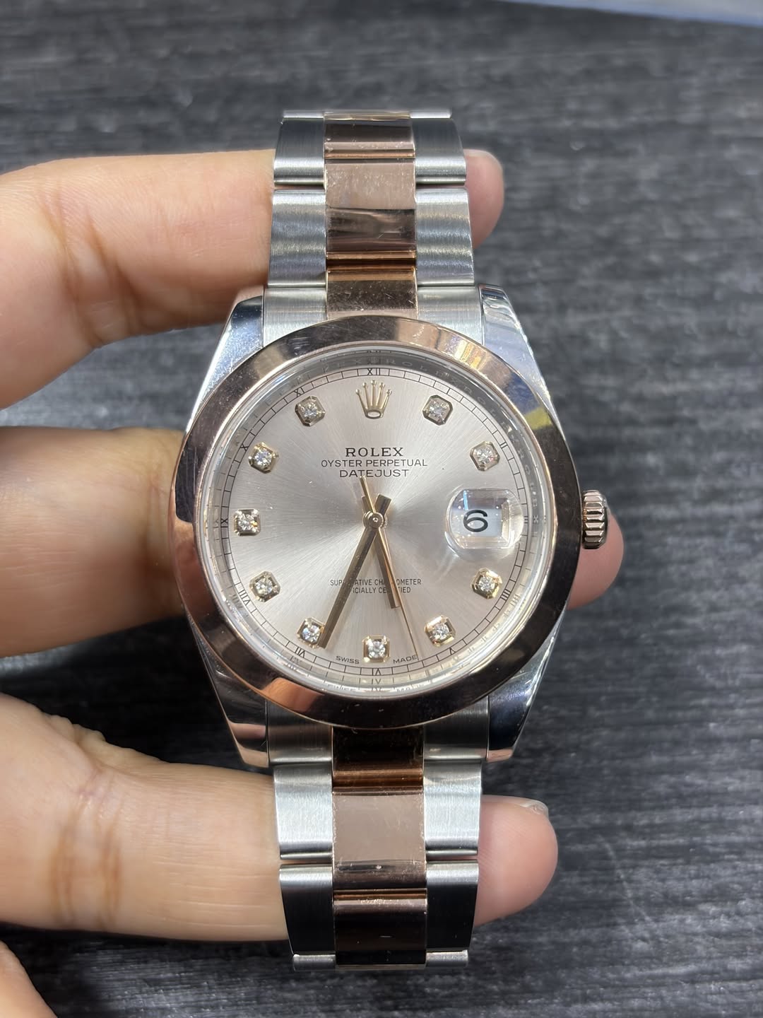 May be an image of wrist watch and text