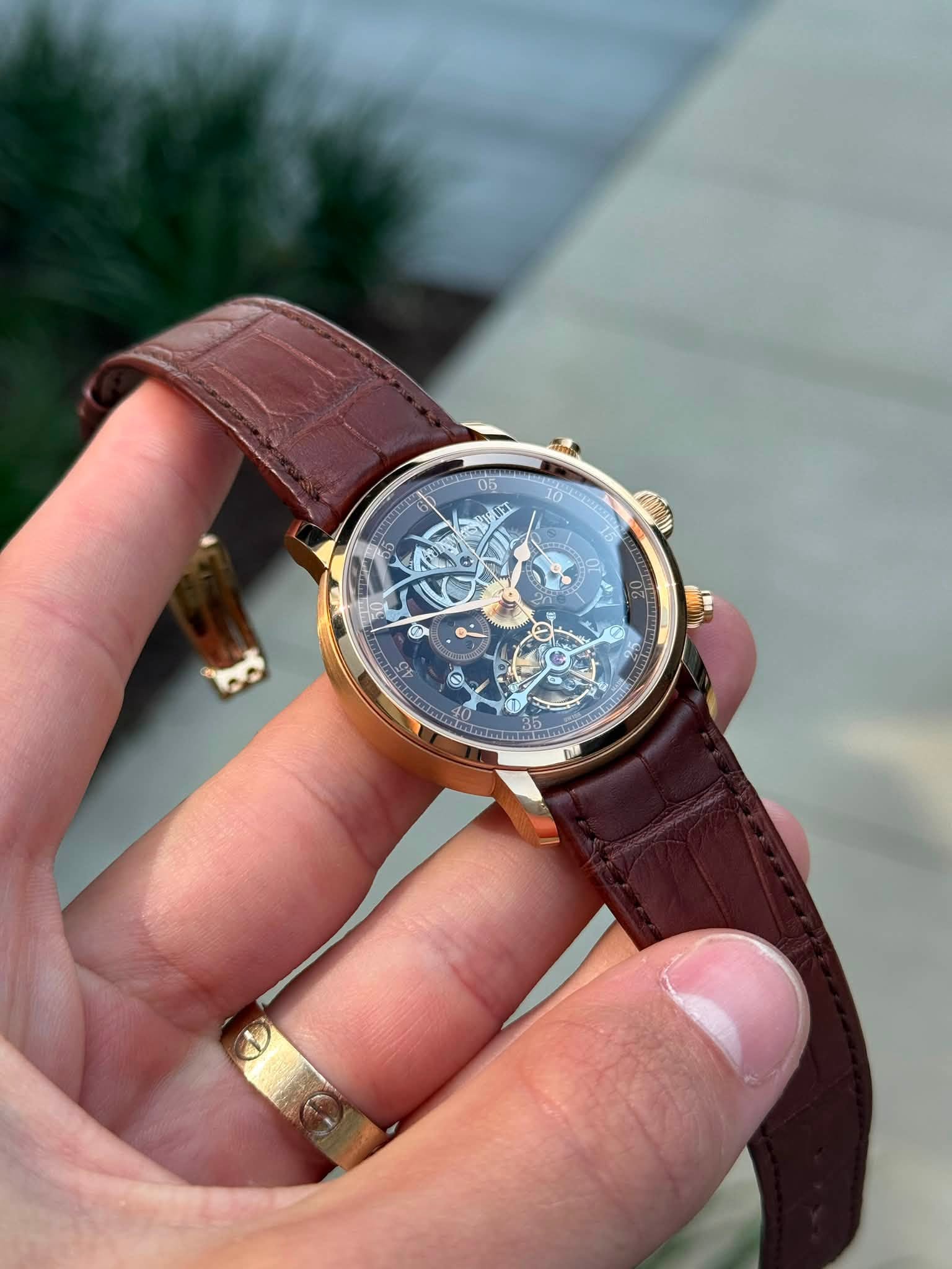 May be an image of wrist watch and text