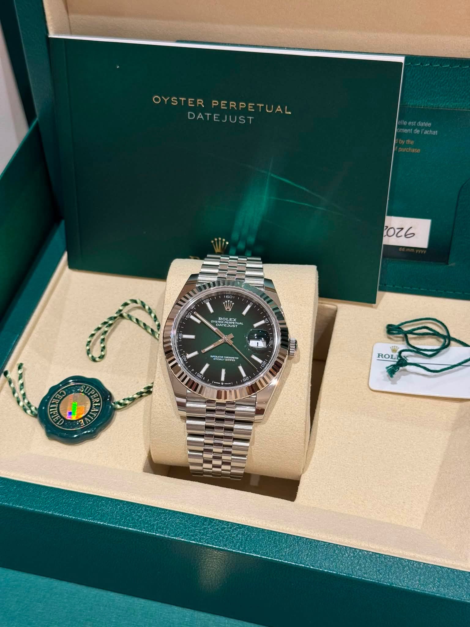 May be an image of wrist watch and text that says 'OYSTER OYSTERPERPETUAL PERPETUAL ETUAL DATEJUST 2026 ROLEX PO ZAT - ግስያም። ー အတာင် a N I ROL'