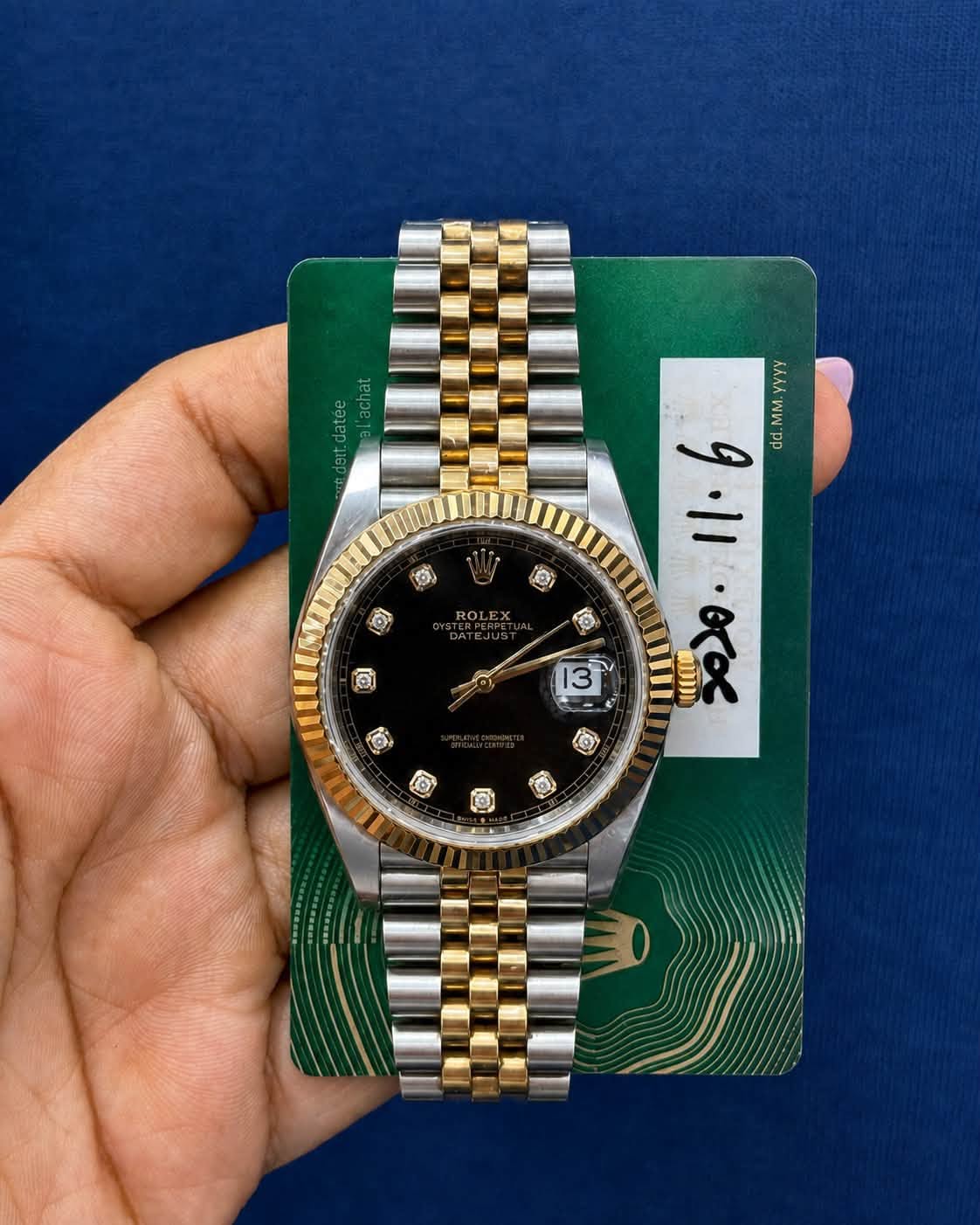 May be an image of wrist watch and text that says 'IO) OI WWV MM.YYYY yyyy to lo 13 9・11・00 1١١ 1.6 6 pp .θτα ROLE @ R'