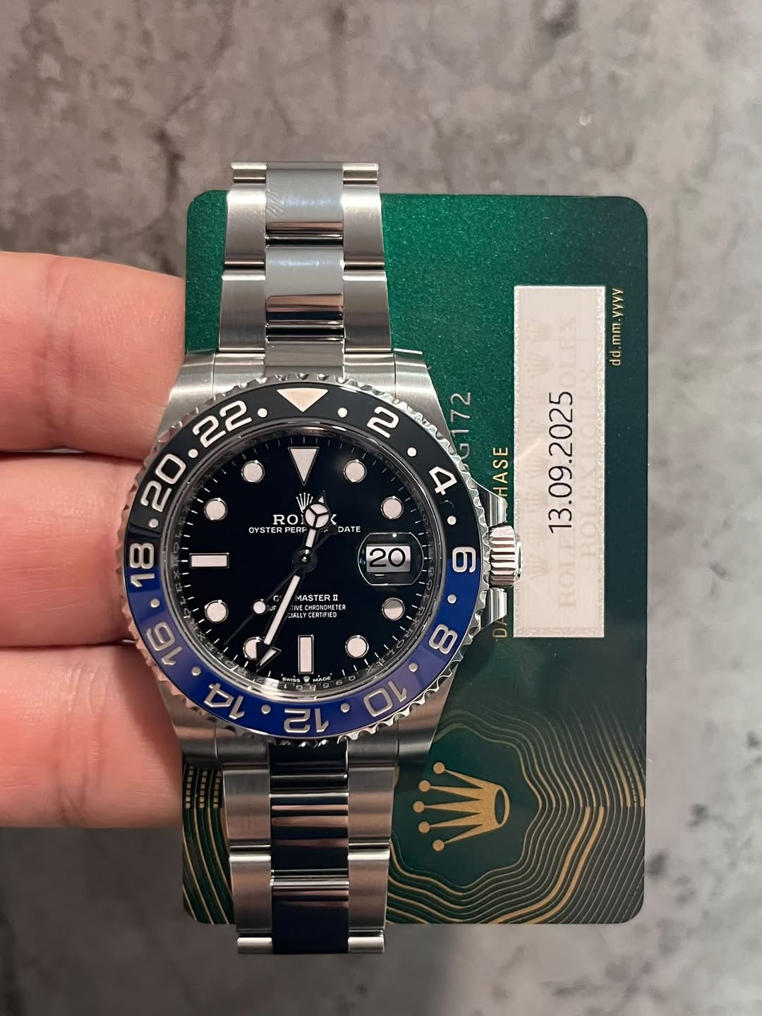May be an image of wrist watch and text