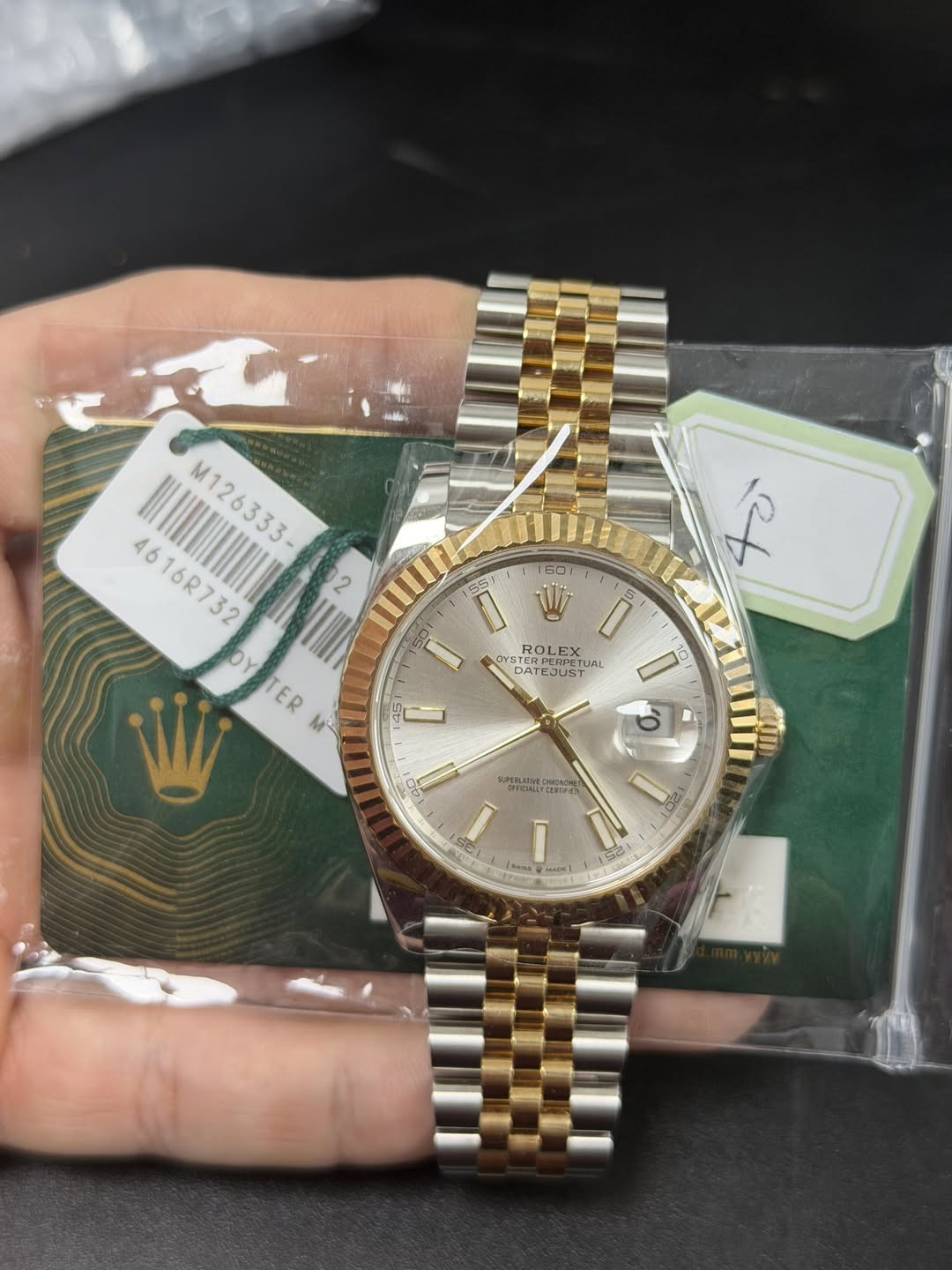 May be an image of wrist watch and text
