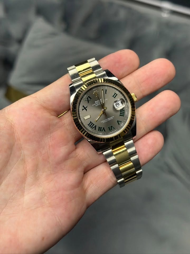 May be an image of wrist watch and text that says '10 TI YSTATE ح Um 8 ፅ/ 1201 SS አታርስክ 0 C 6 ل'