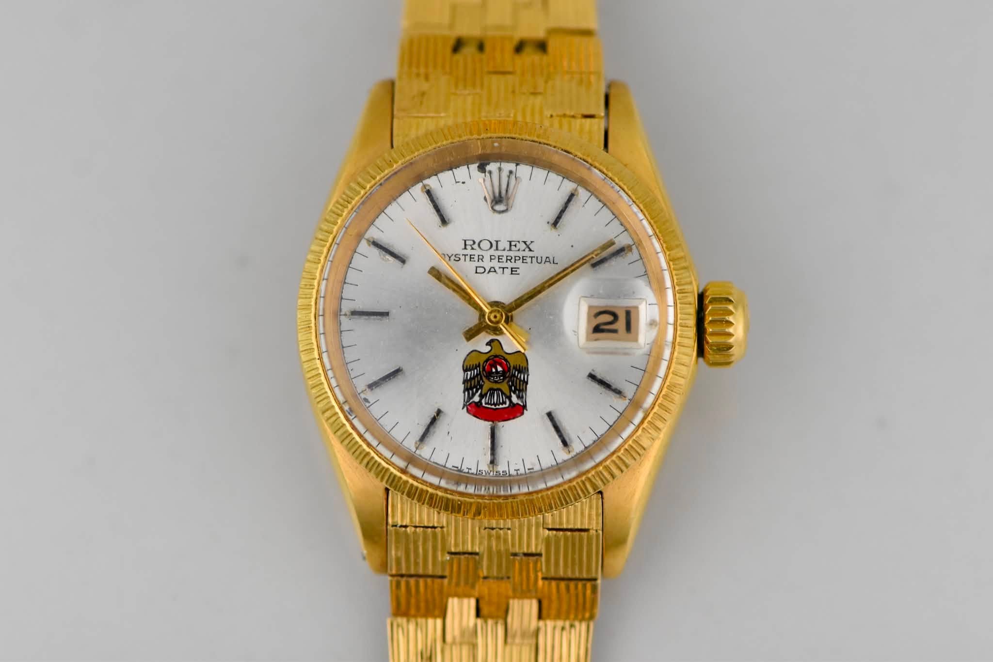 May be an image of digital watch and text that says 'ROLEX EX YSTER PERPETUAL YSTERPERPETUAL PERPET TUAL DATE E 21 000'