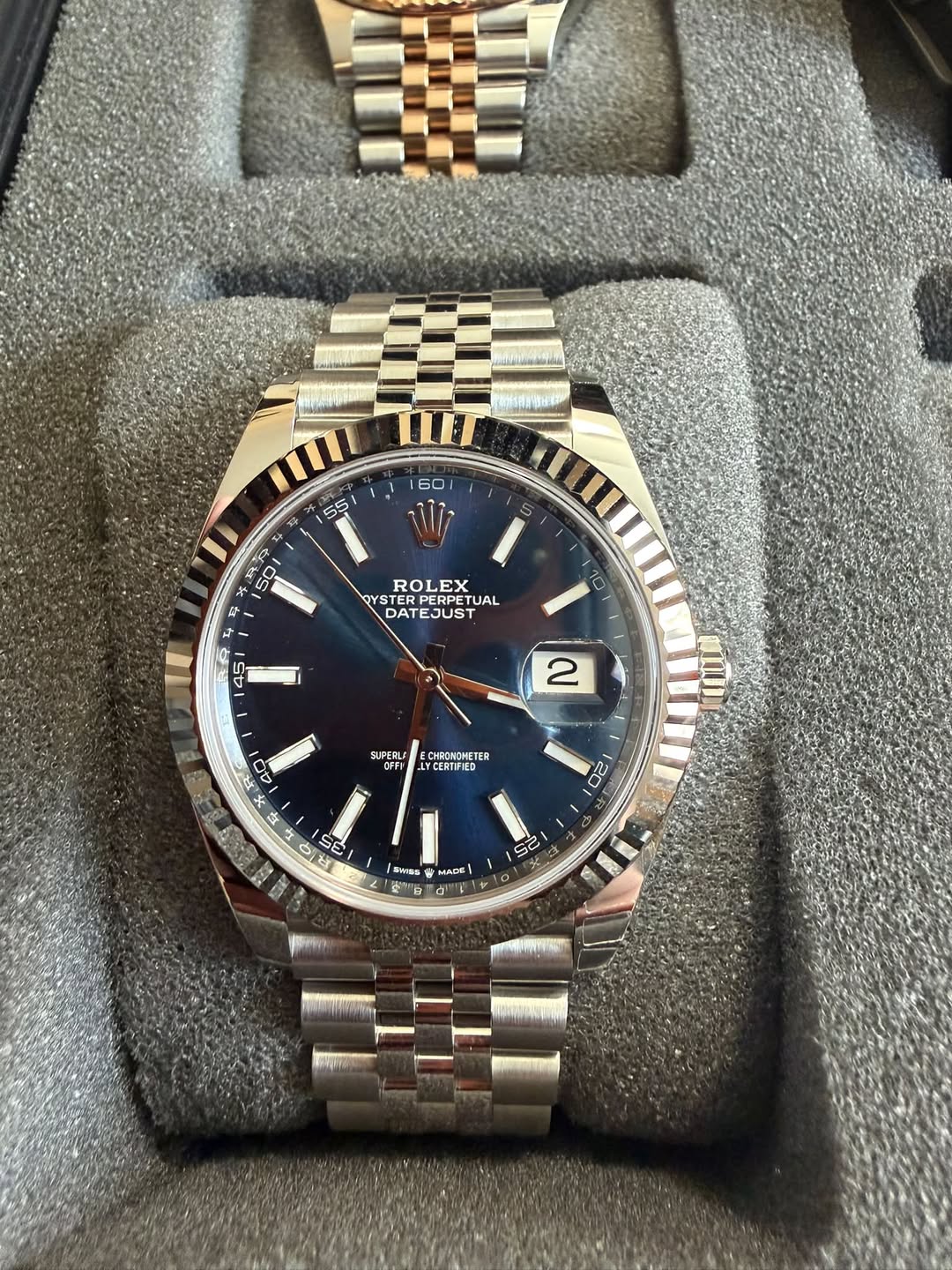 May be an image of wrist watch and text