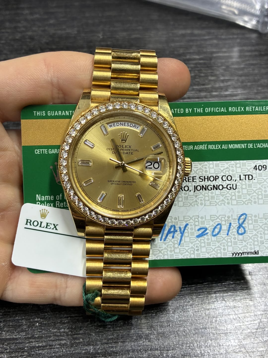 May be an image of wrist watch and text