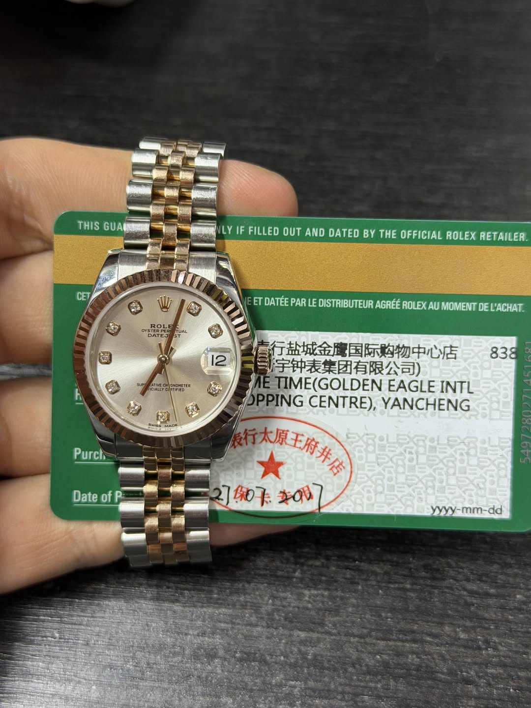 May be an image of wrist watch and text