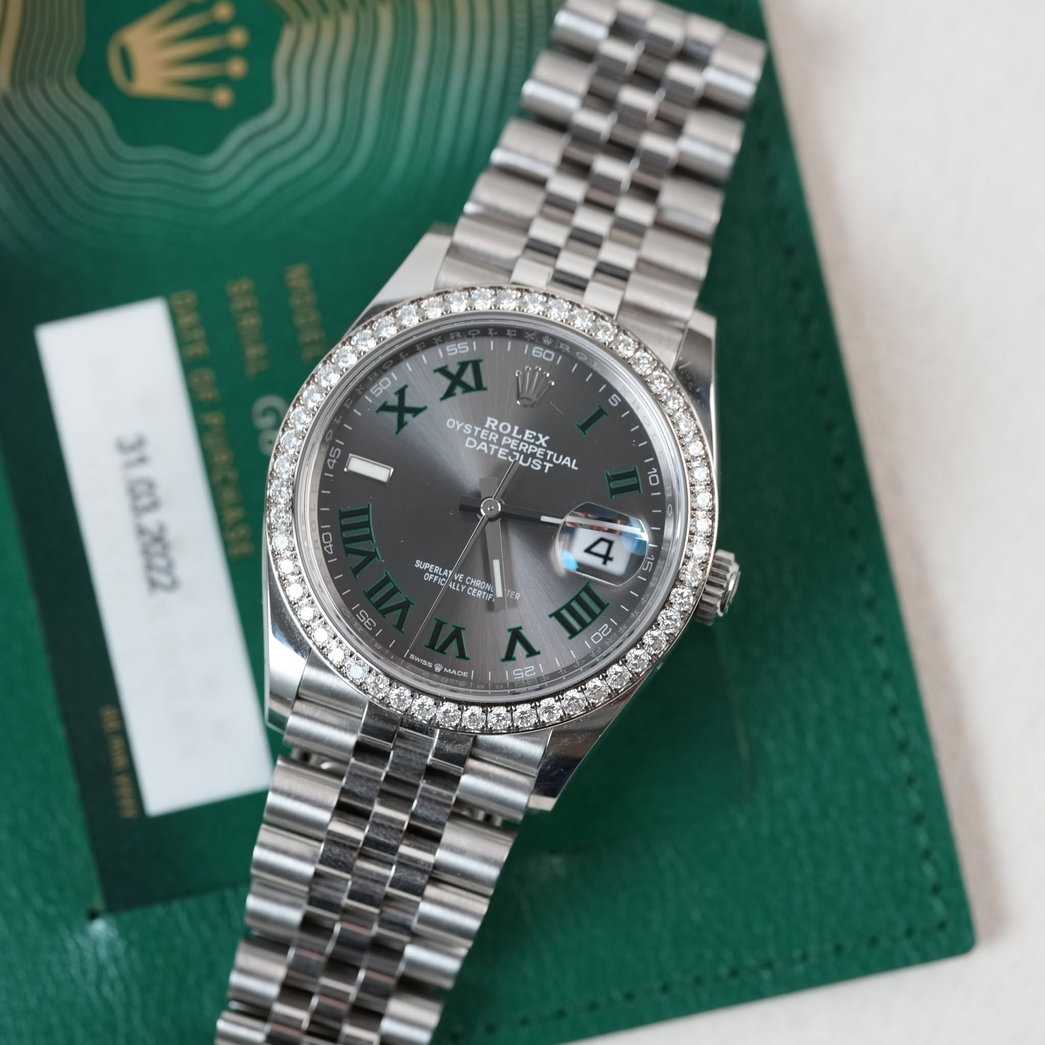 May be an image of wrist watch and text