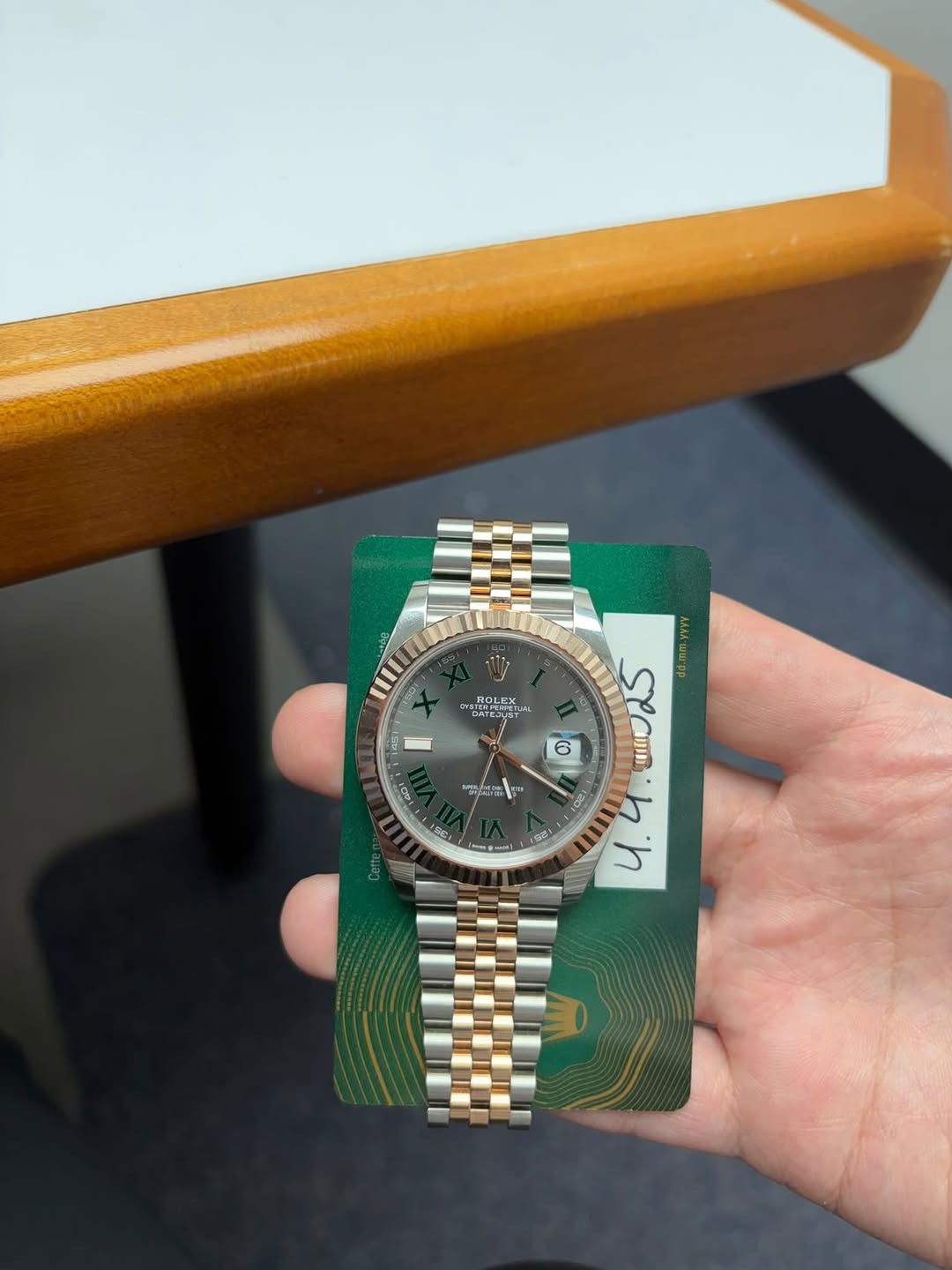 May be an image of wrist watch and text