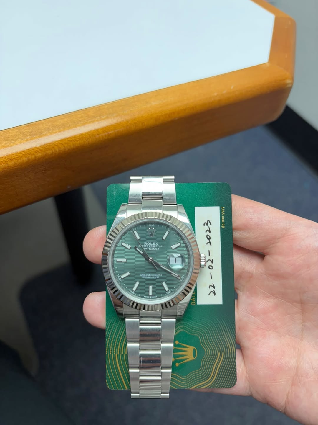 May be an image of wrist watch and text