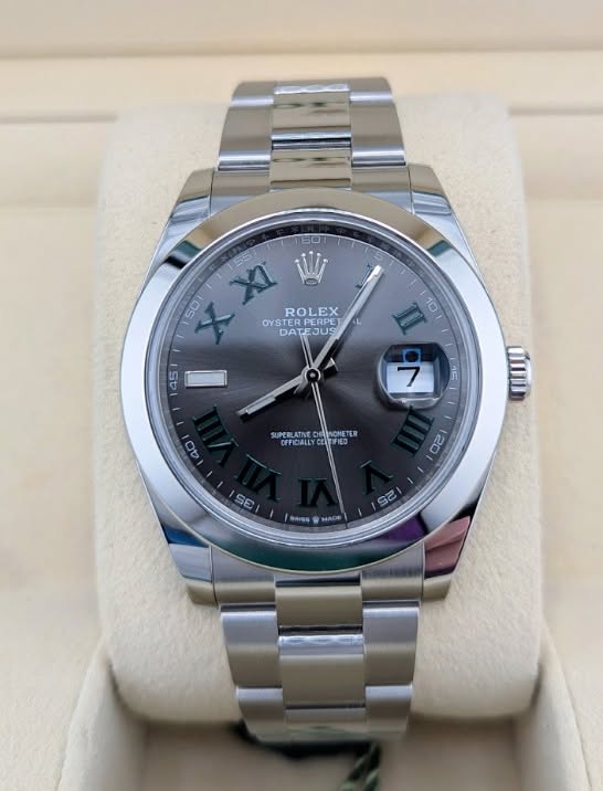 May be an image of wrist watch and text that says '60 50 XI 55 ROLEX OYS OYSTE ERPERPE PERPET OYSTERPERPE DATEJUS EJUS DA II NE 40 EA SUPER NONETER CFFICALLYCEITFIED OFFICIALL…