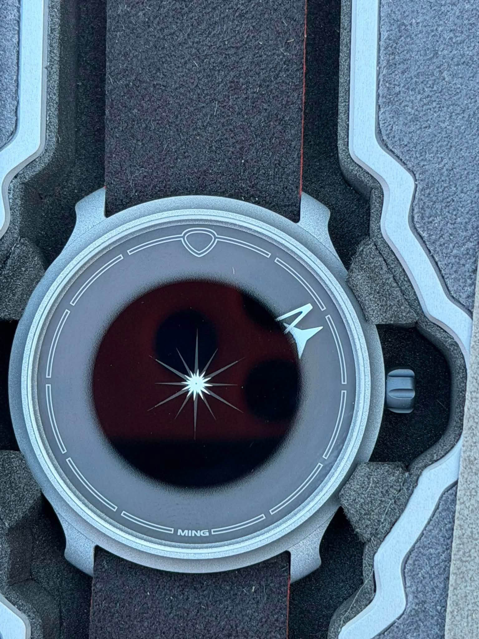 May be an image of wrist watch and text that says 'M MING G'
